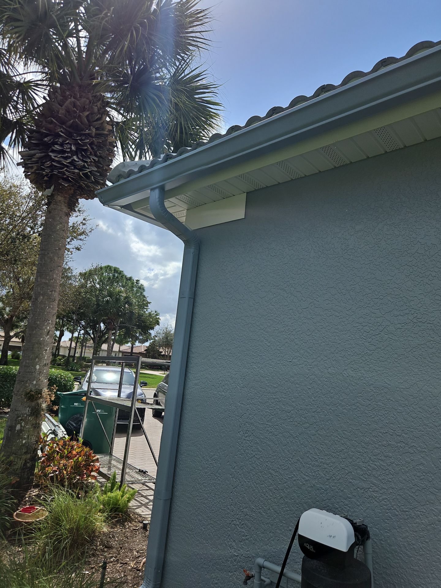 6-inch K-style Seamless Gutters and Splash Guard in Grey Color in Naples FL by Gutter Professors