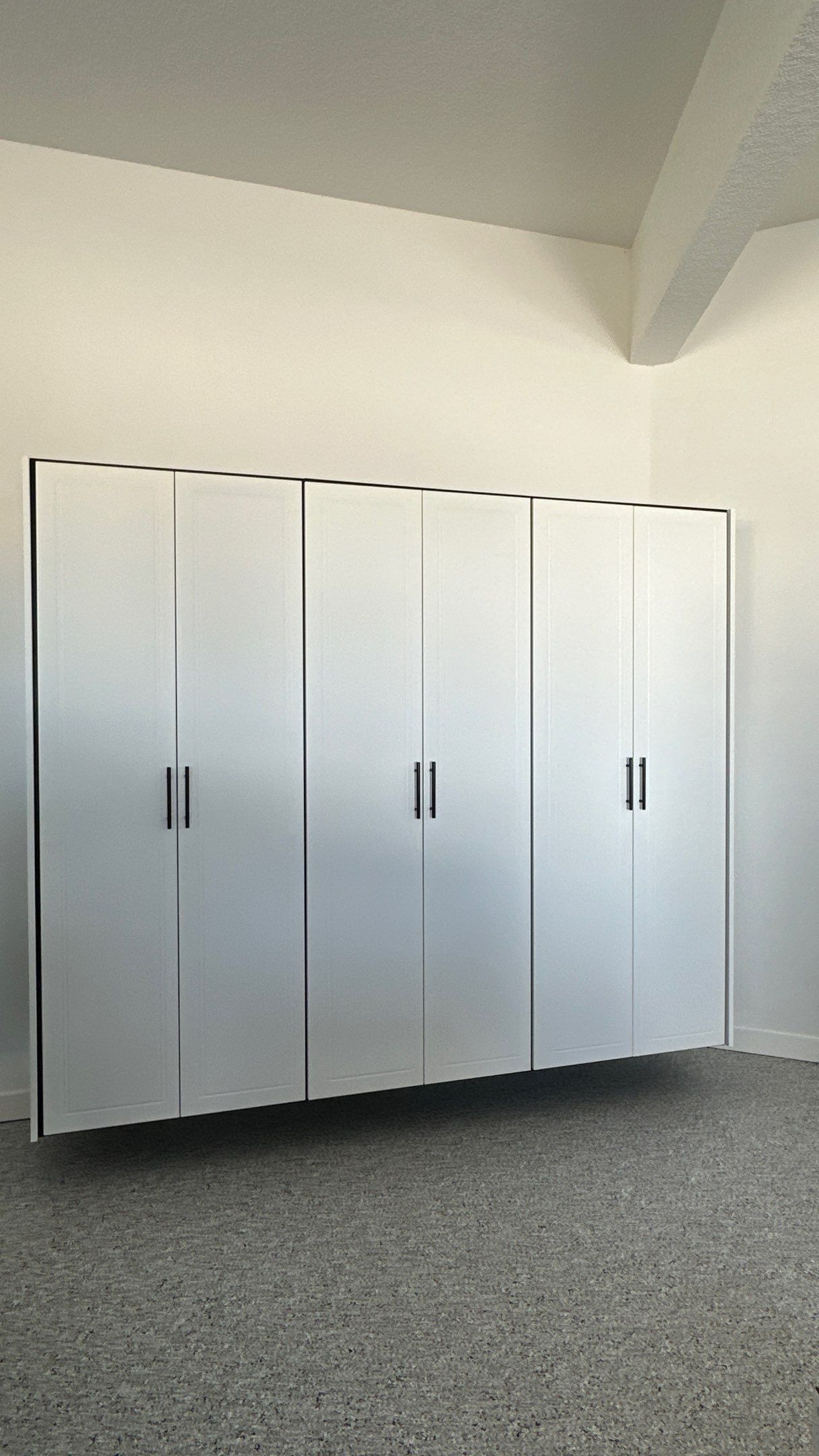 Jon S. transformed his garage with a new floor, slotwall & Cabinets!  by Banner Garage