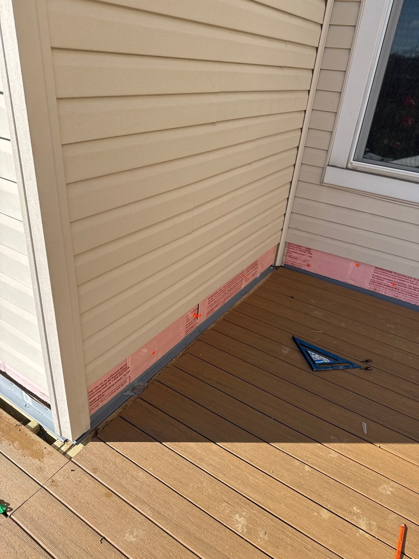 Deck and door by Cousins Roofing Siding & Decks