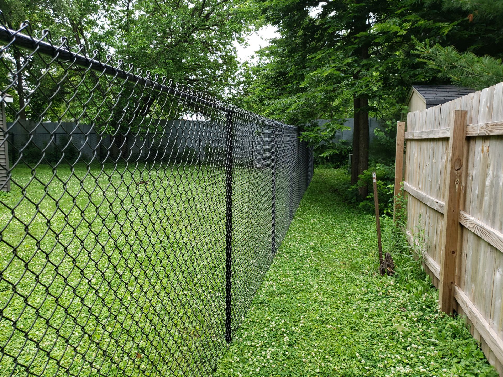 Black Vinyl Chain Link Fence Installation in Charles City by Perfect Picket Fence and Stain