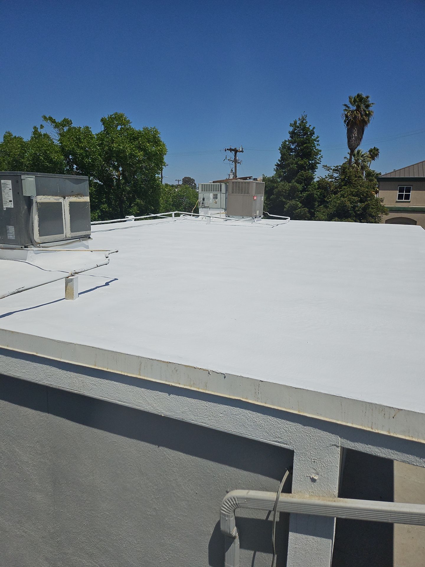 Foam Refurbish using General Coatings acrylic coatings and spray foam by Straight Edge Roofing Inc