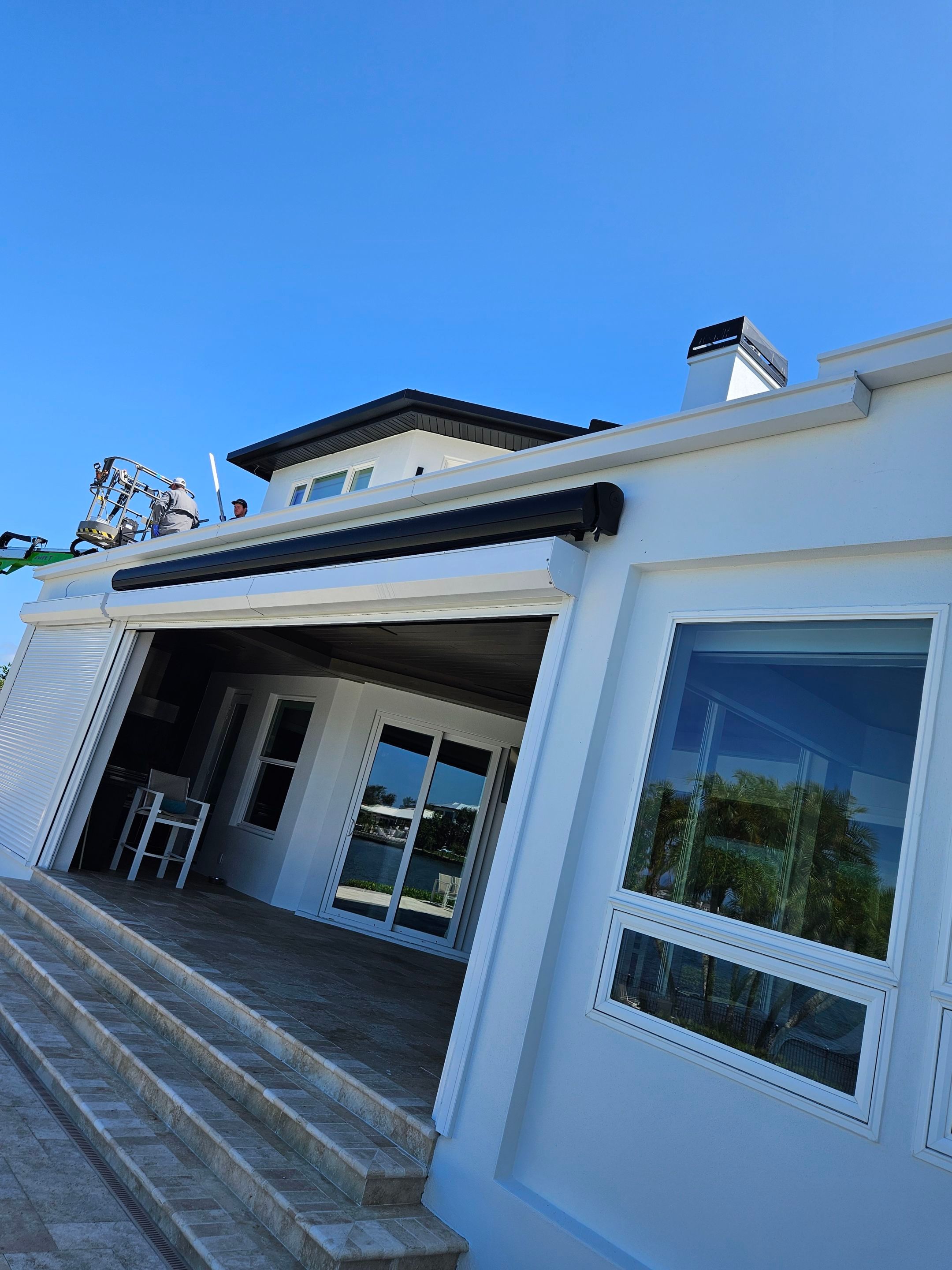 Soffit and Fascia Installation and black seamless gutters in Sarasota FL by Gutter Professors