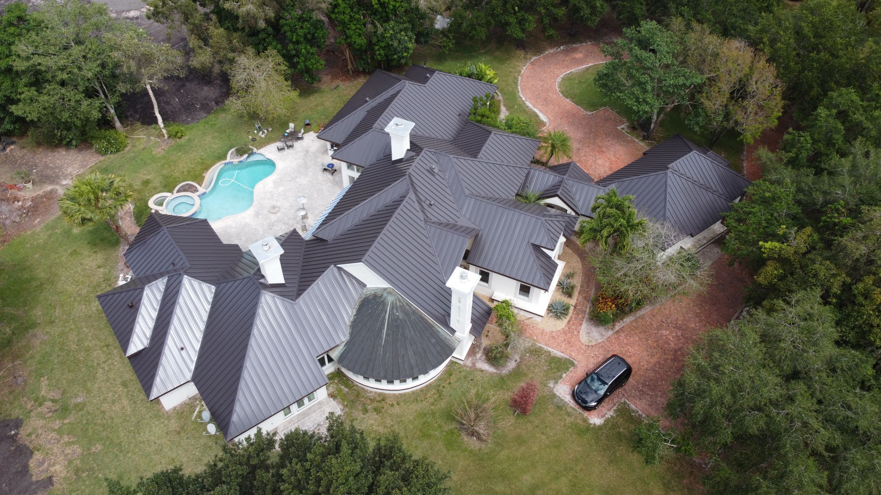 Residential Roofing Installation using 1" Nail strip metal roof by BLUES BROTHERS CONSTRUCTION CORP