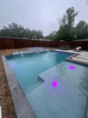 Modern Geometric Pool with Sheer Descent Water Feature