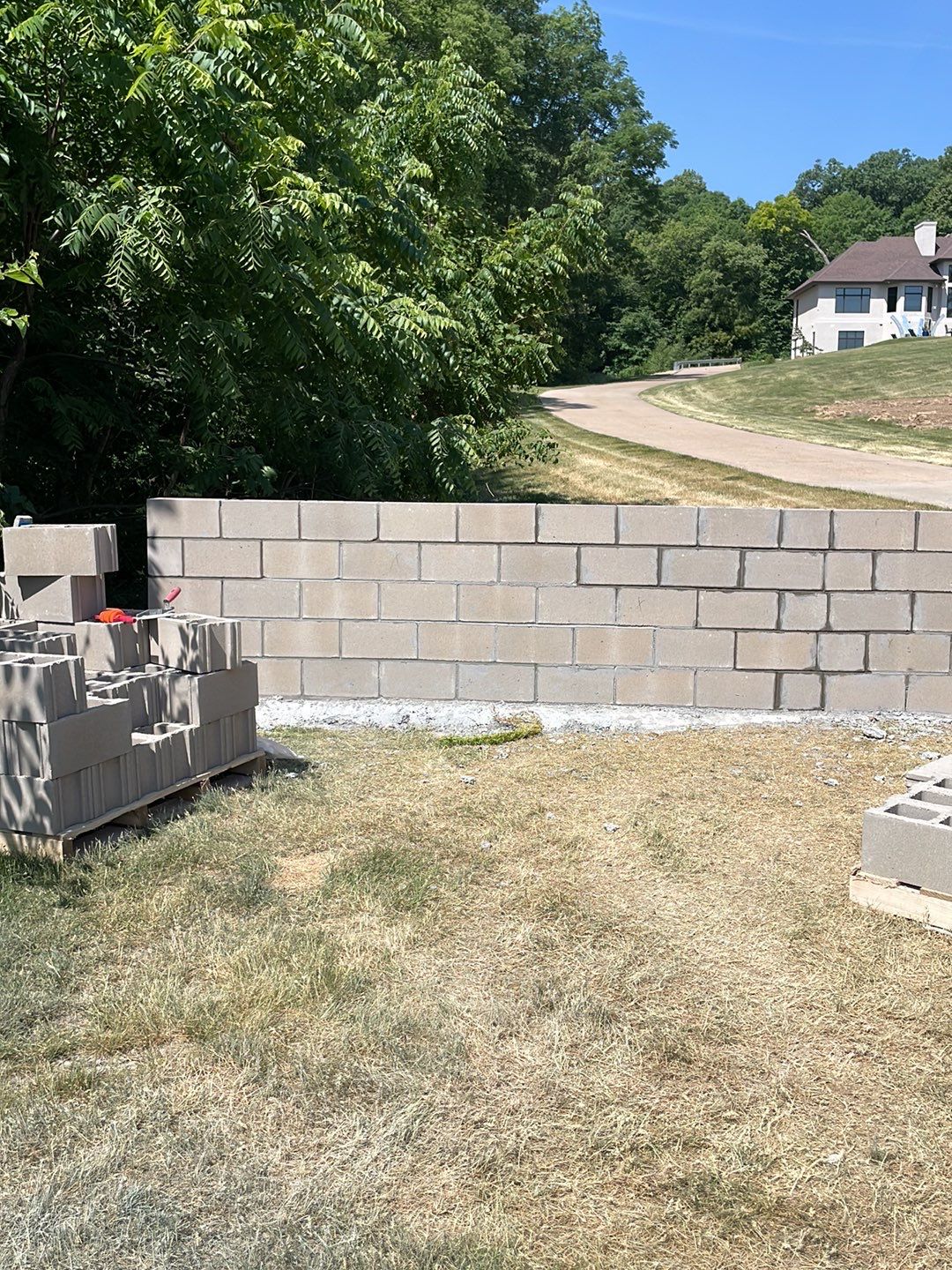 Fence / Retaining Wall using Block then parge by ACE Waterproofing & Basement Solutions