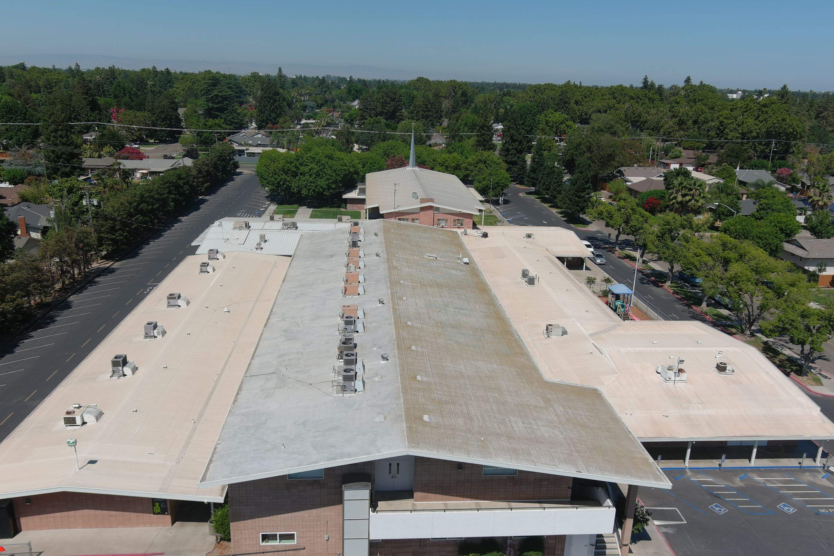 MR Roofing system using Benchmark/PUMA XL coatings over TPO single-ply roofing by Straight Edge Roofing Inc