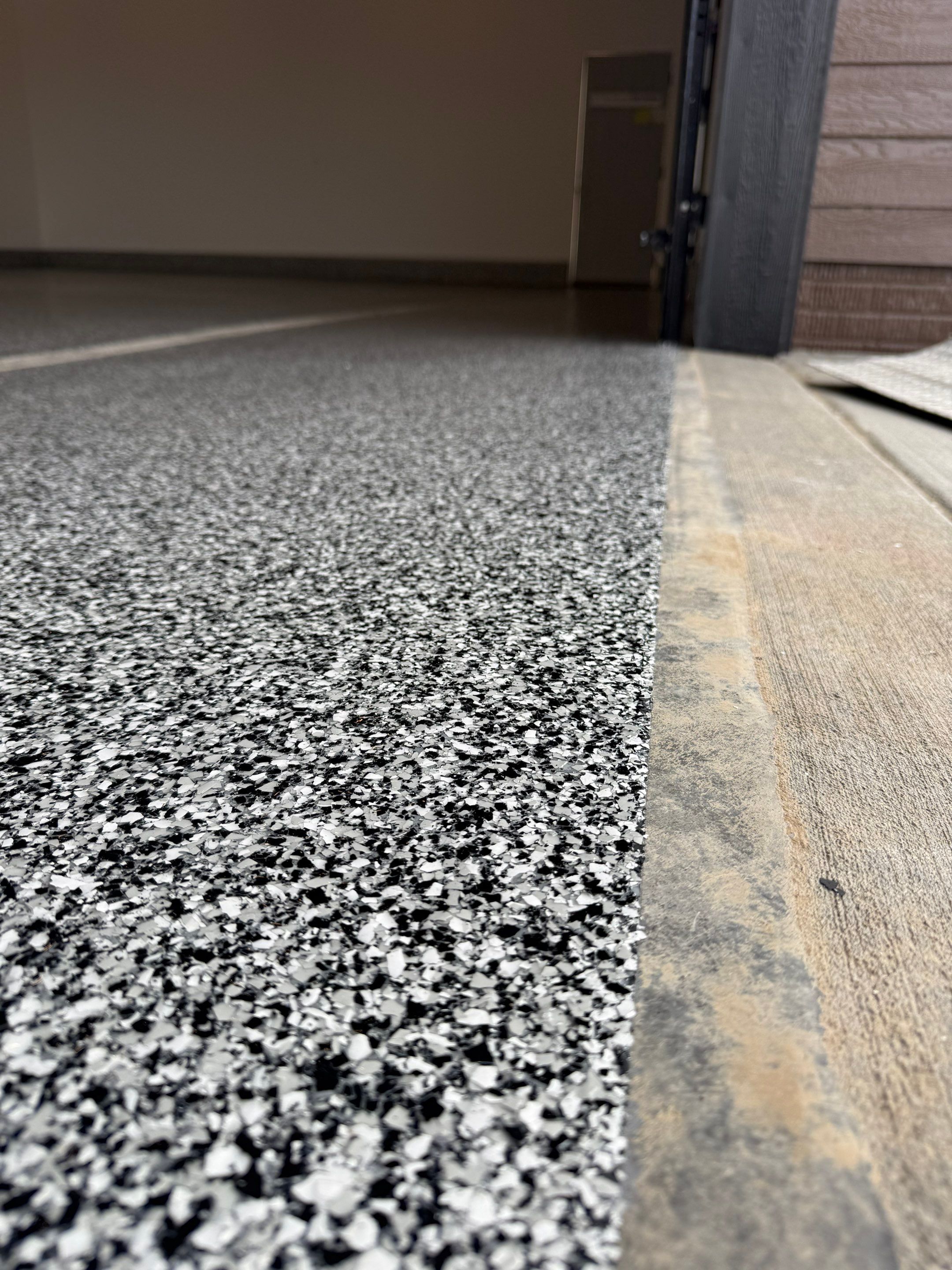 Multi-Car Garage Epoxy Floor Coating and Concrete Finishing in Sioux Falls by Select Painting, Coatings & Garage Cabinets