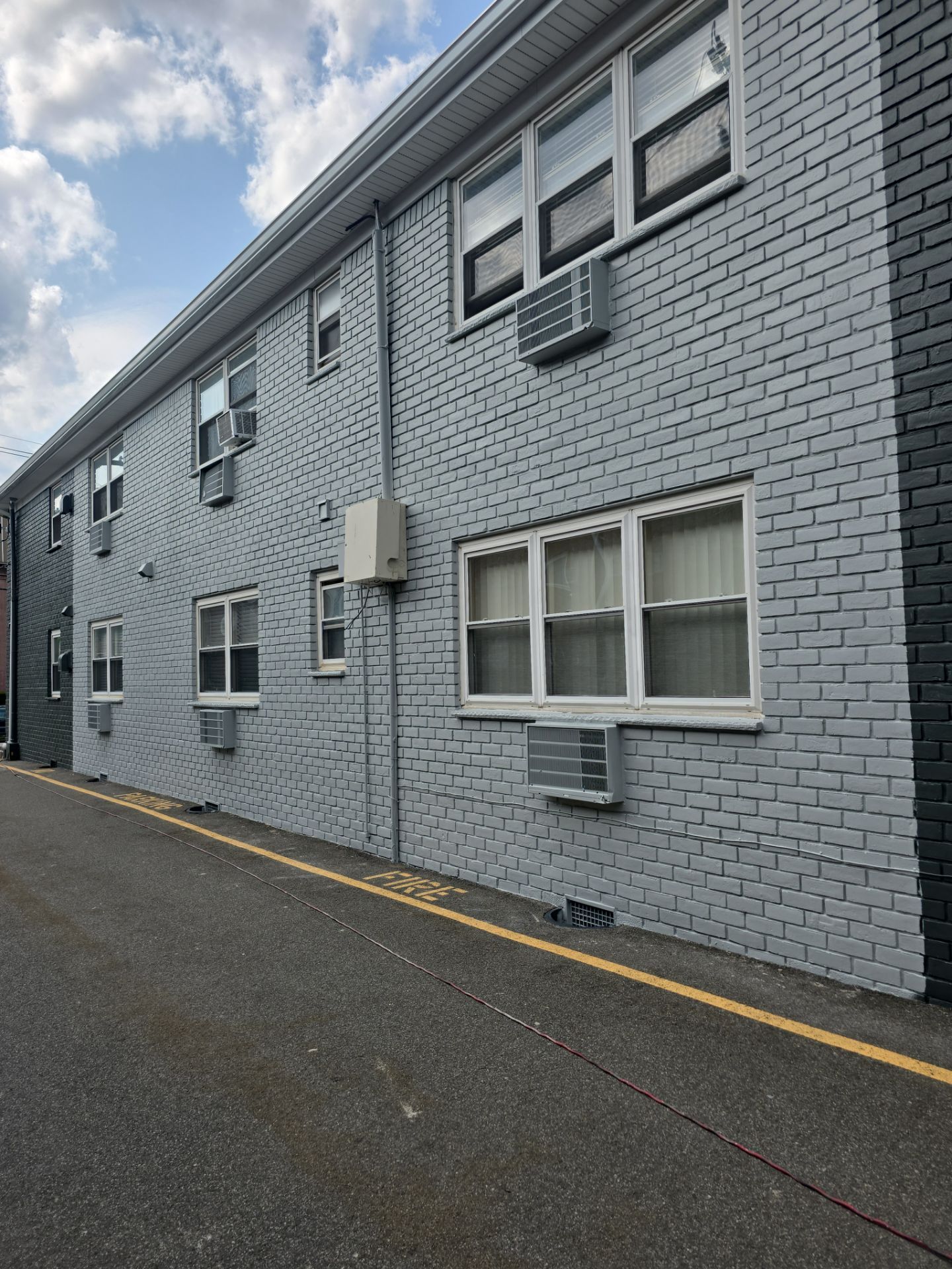 Multi-Unit Apartment Complex Exterior Brick Painting Project in Hackensack by Spectrum Painting, LLC