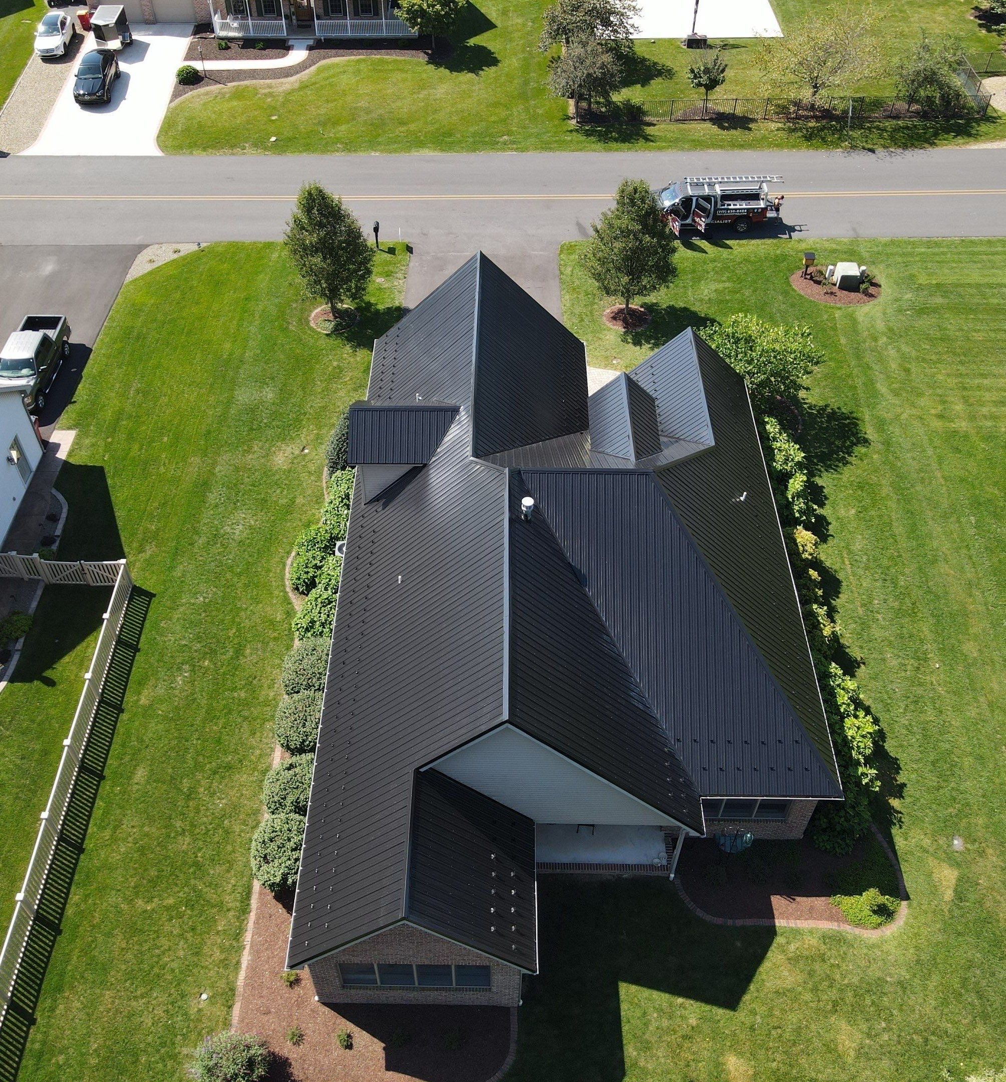 Standing seam / Azm panel in black  by Teflon Roofing