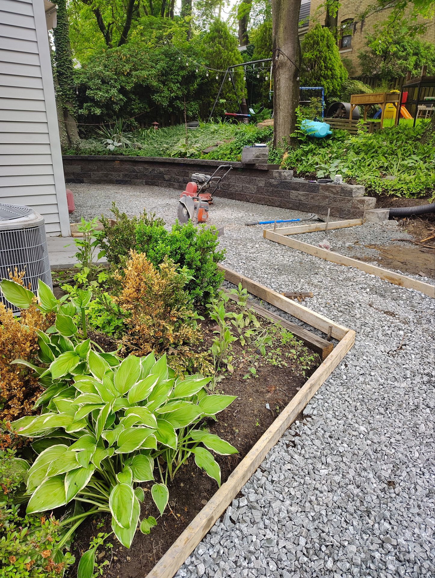 Stamped Concrete and Retaining Wall by Cousins Roofing Siding & Decks