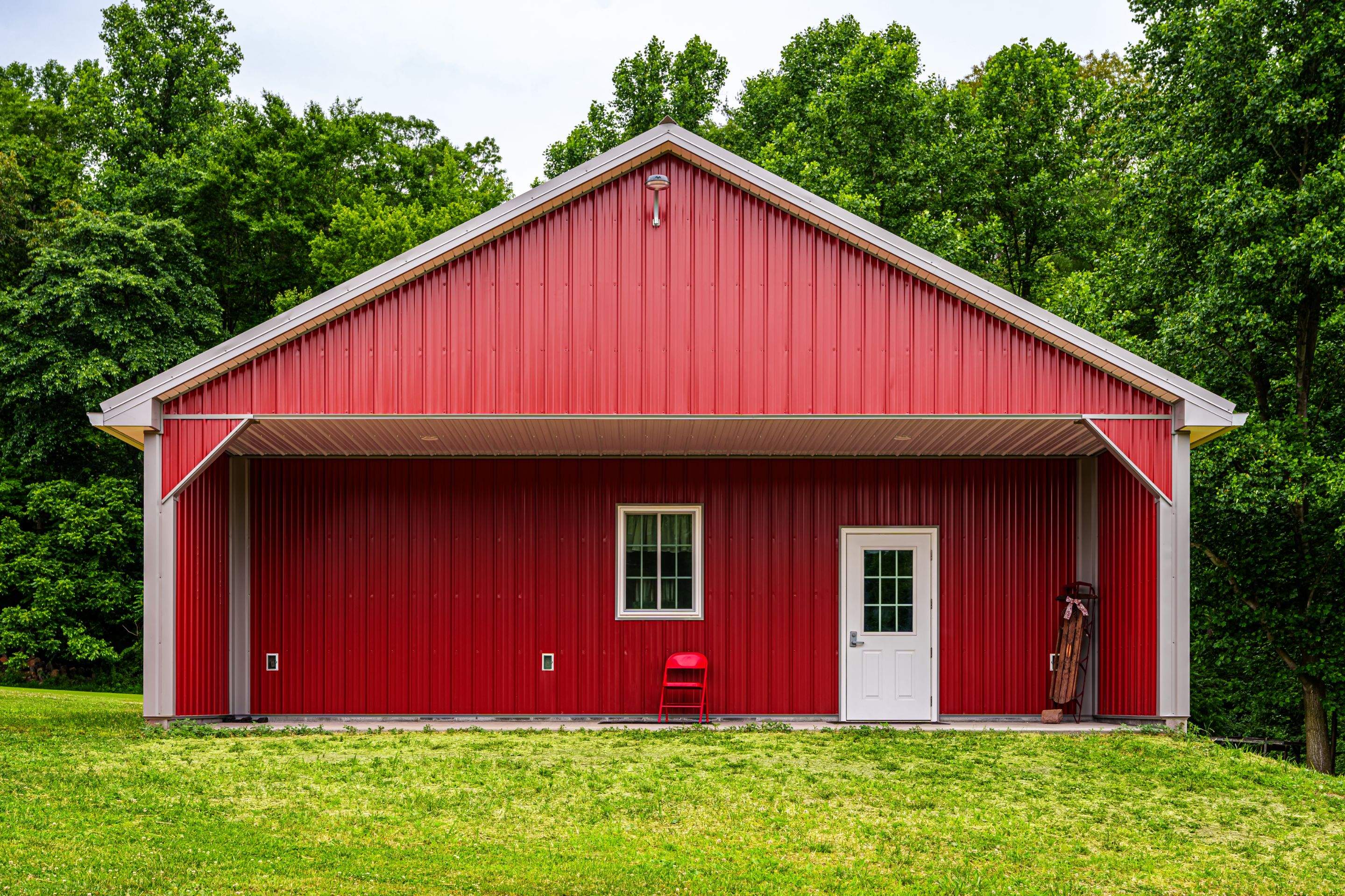 Metal roof -barn red, and New garage by Esh Builders