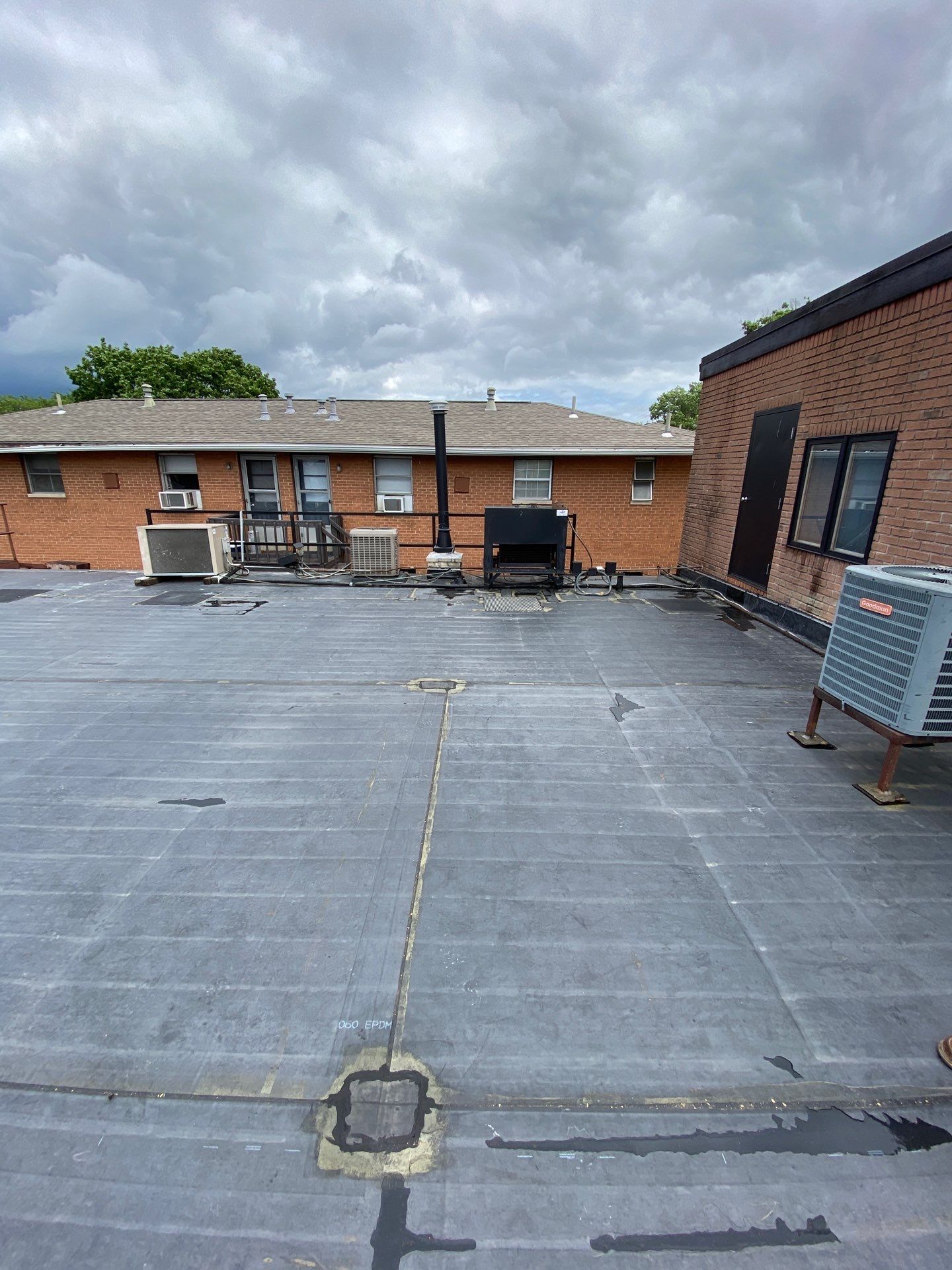 Commercial Roofing Installation using 60 mil rubber roof  by Nitro Roofing and Construction