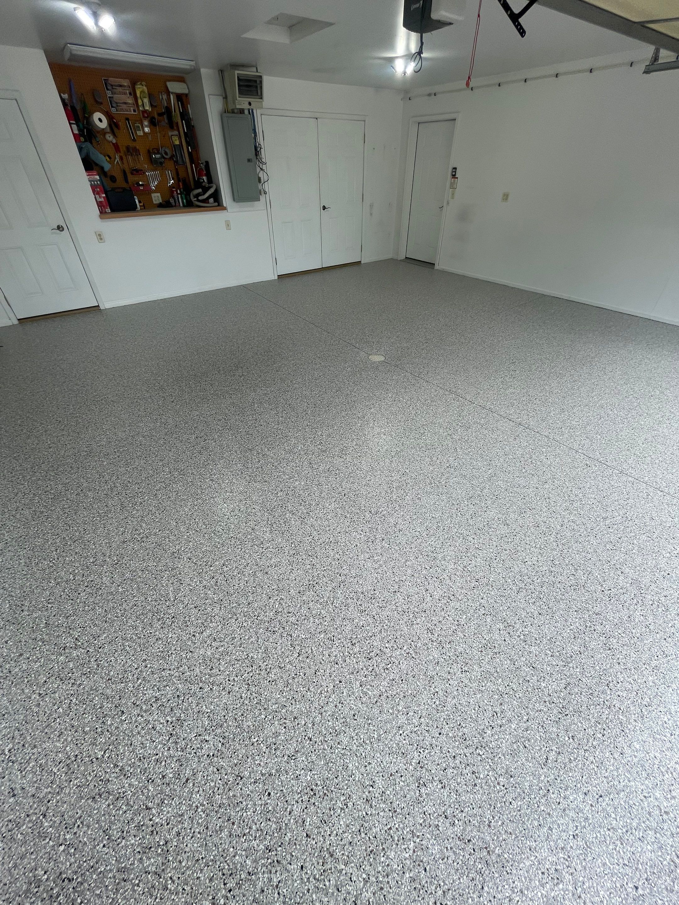 Coyote Flake Garage Floor Coating in Worthington, Minnesota by Select Painting, Coatings & Garage Cabinets