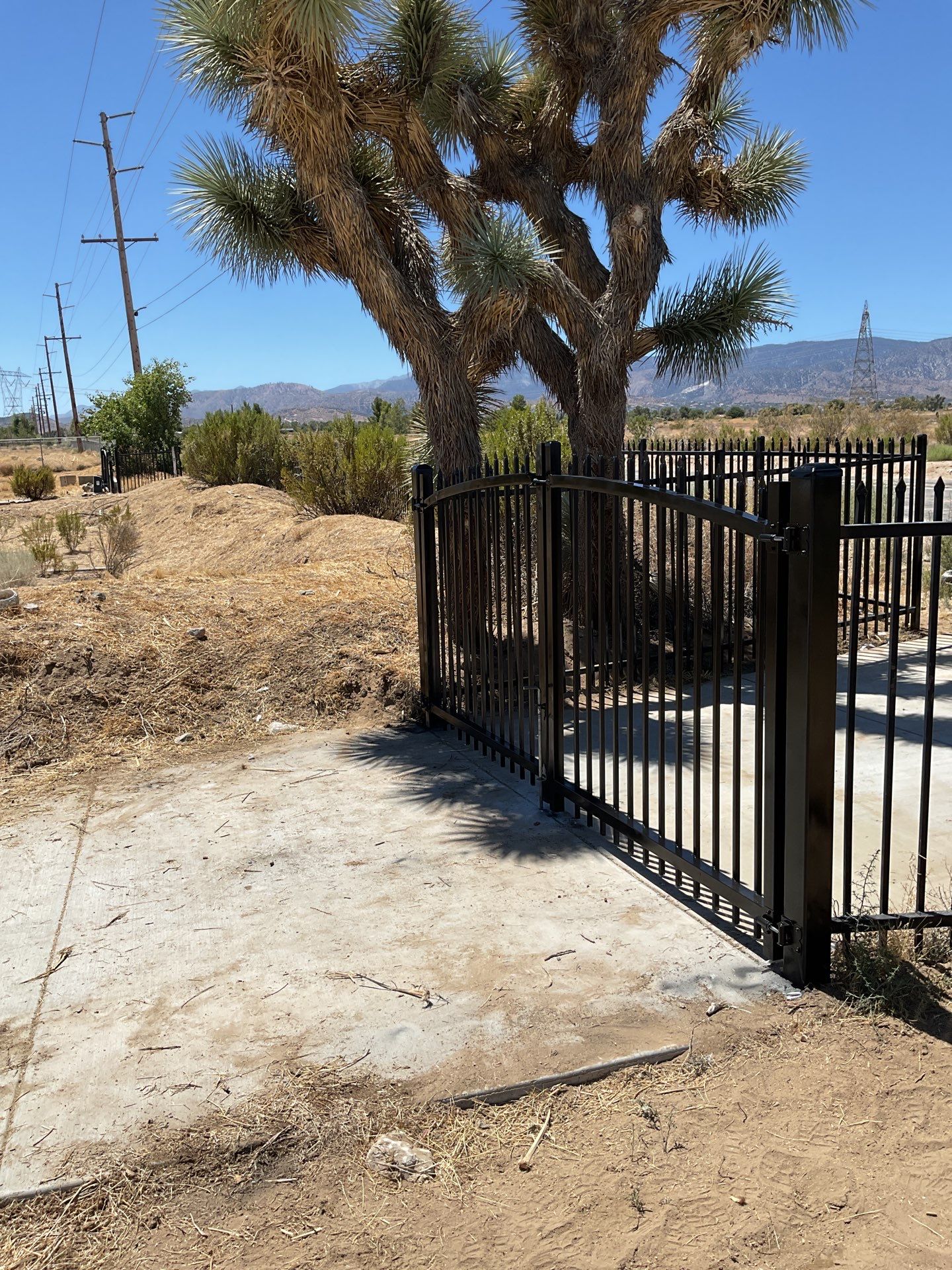 Gate installation using Wrought Iron by Fence Guys Inc. 