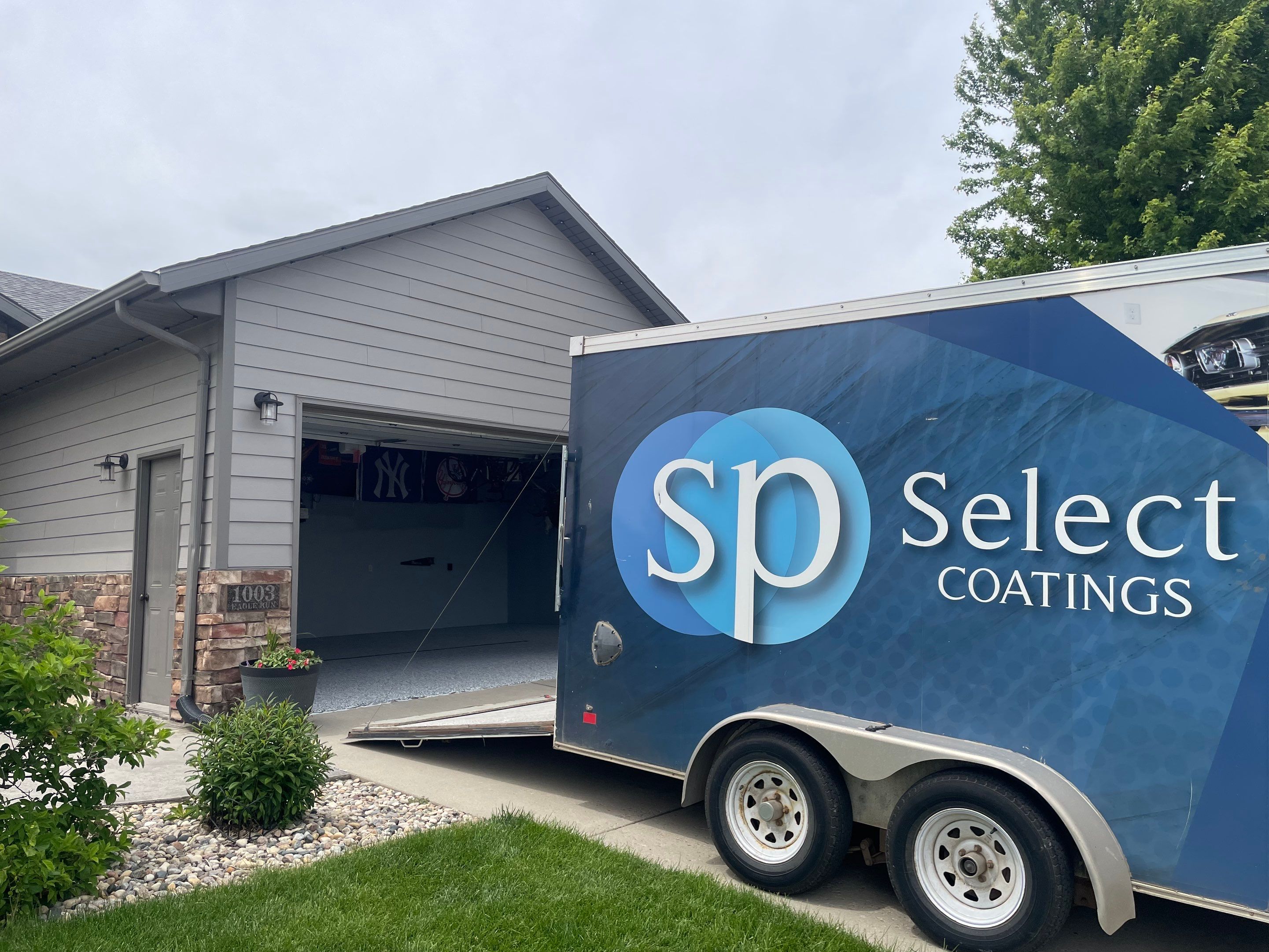 Full Garage Floor Epoxy Coating Installation in Dell Rapids by Select Painting, Coatings & Garage Cabinets