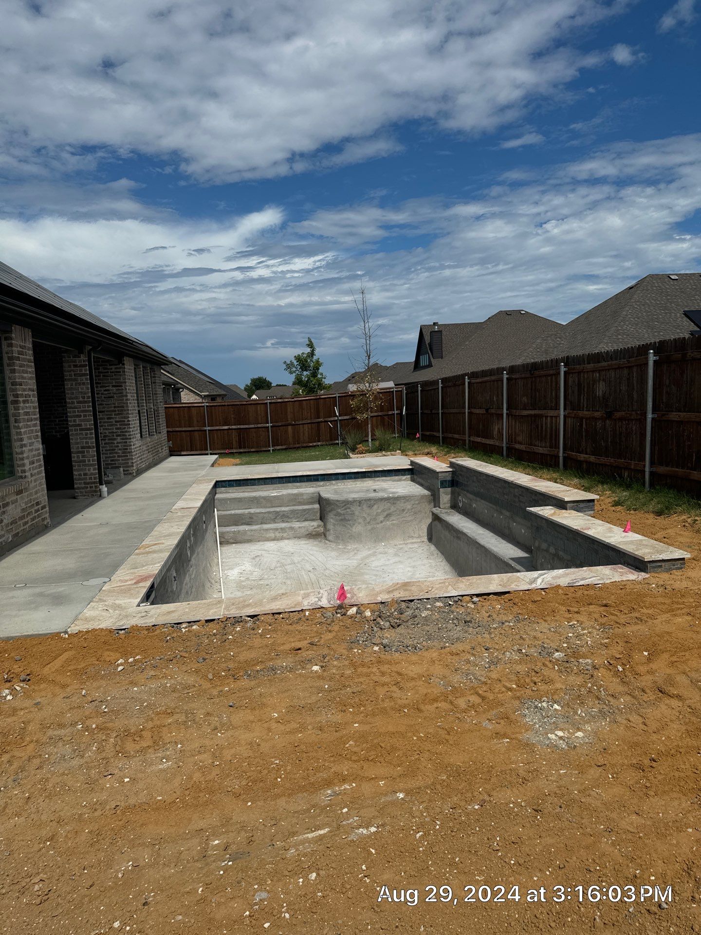 Geometric Pool with Tanning Ledge by Pinnacle Pools and Spas - DFW