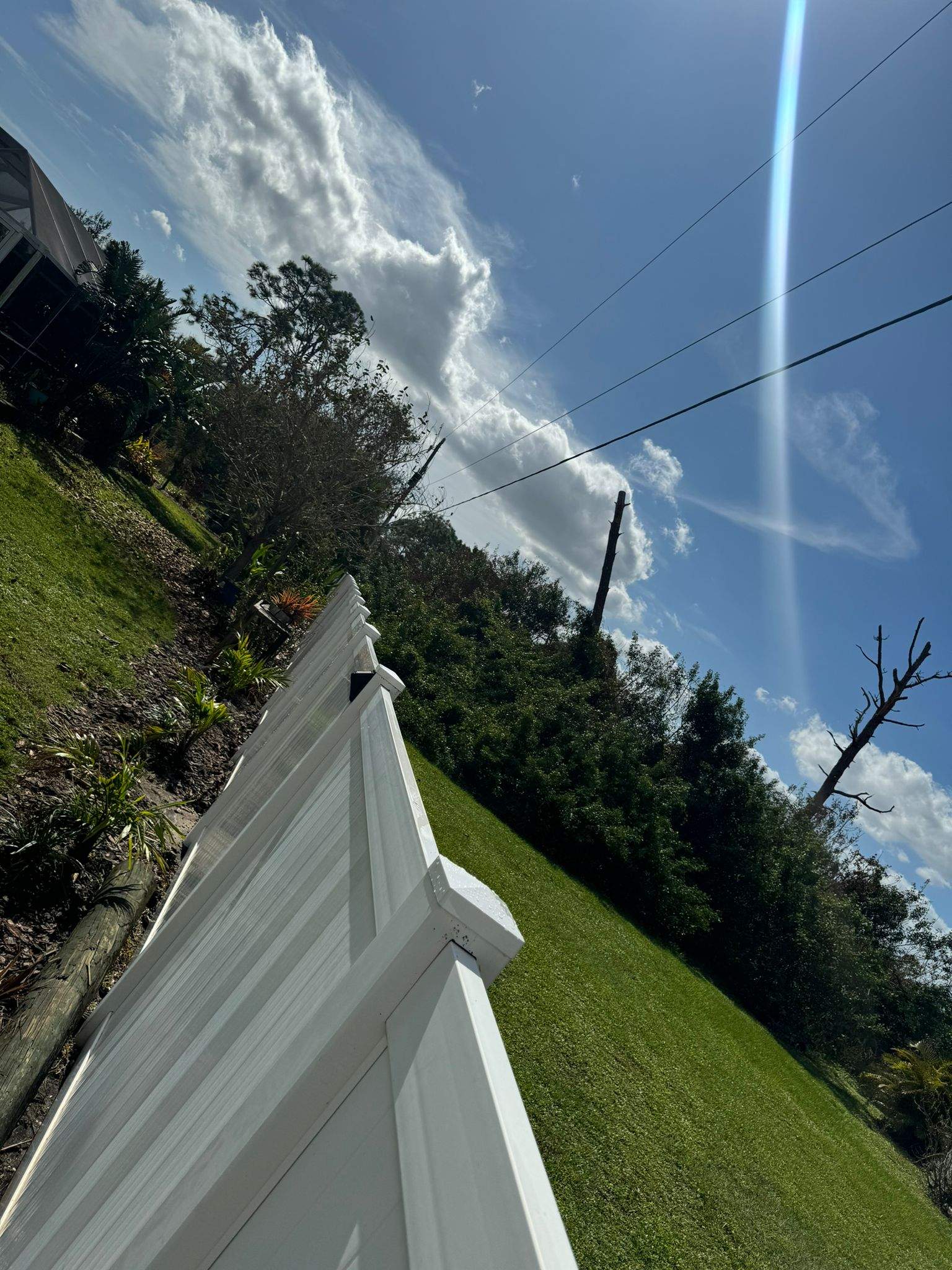 White Vinyl Privacy Fence Installation in Port Charlotte by True Fence LLC