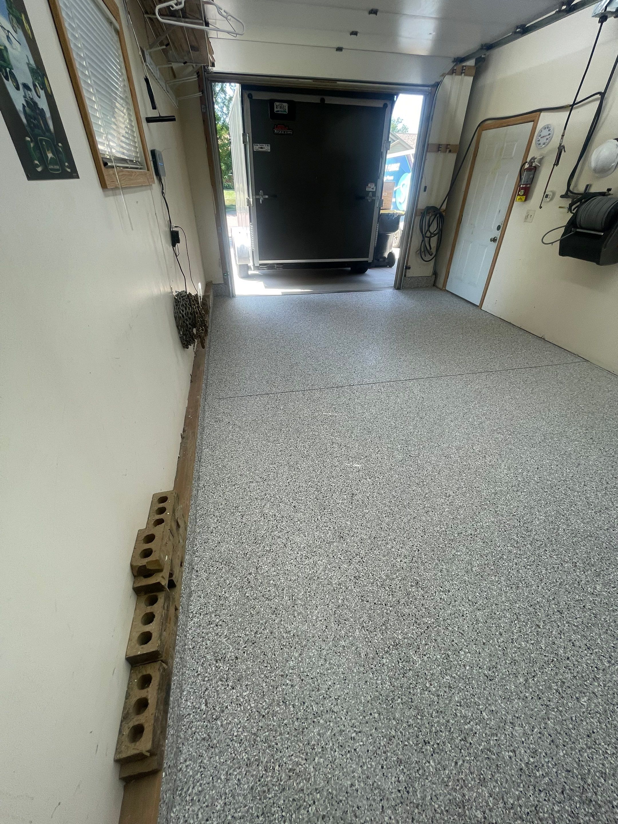 Multi-Stall Garage Floor Coating Installation in Sioux Falls by Select Painting, Coatings & Garage Cabinets