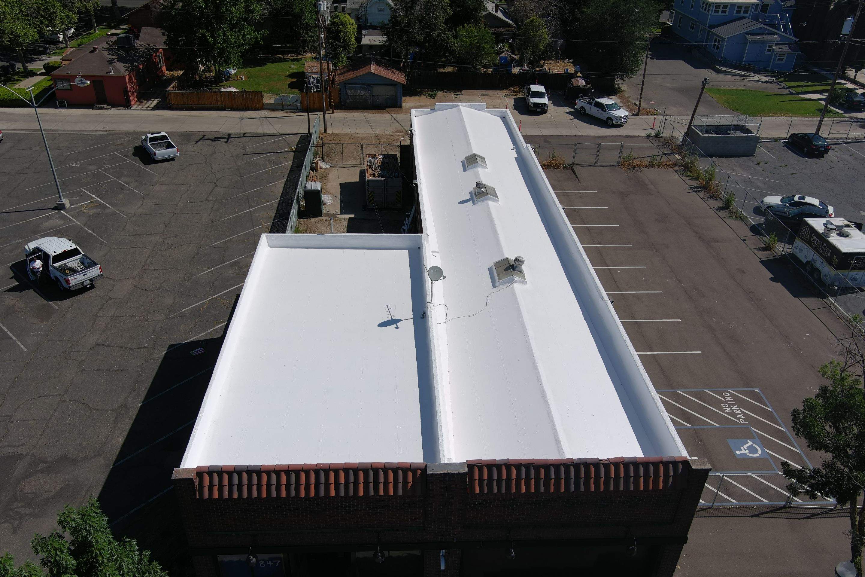 Commercial Roofing Installation using Conklin BenchPly system with PUMA top coat (imbedded fabric system) by Straight Edge Roofing Inc