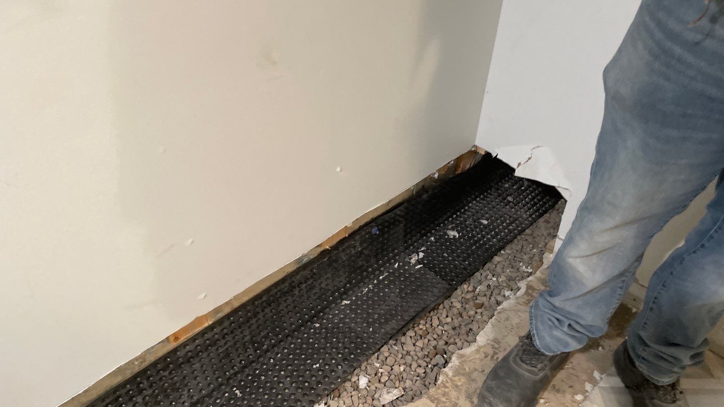 Interior Drain Tile & Buried Discharge in St. Anthony, MN by Waterproofing Northeast