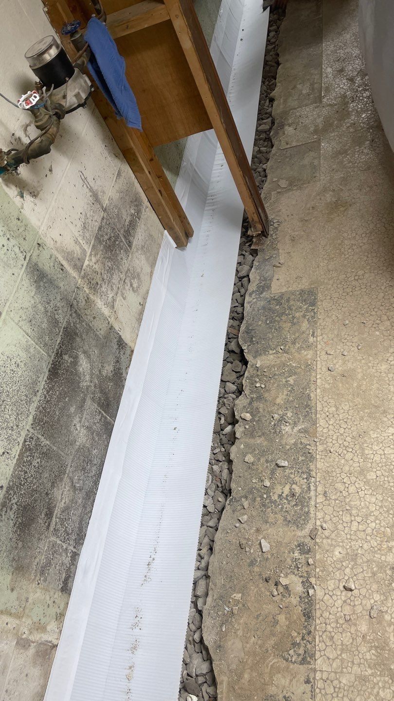 Interior Waterproofing Using GrateDrain™ Products by Toledo Basement Repair 