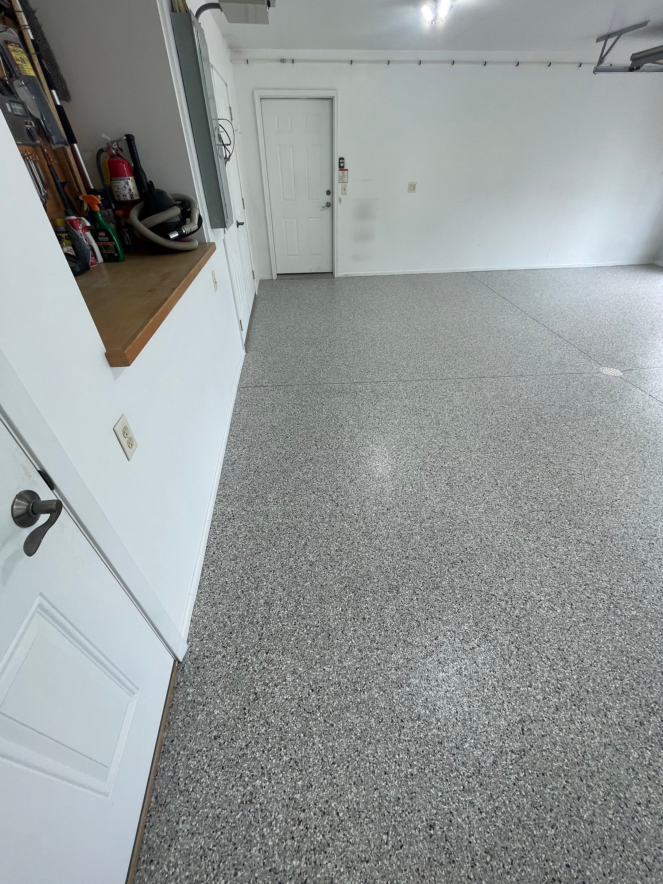 Coyote Flake Garage Floor Coating in Worthington, Minnesota by Select Painting, Coatings & Garage Cabinets