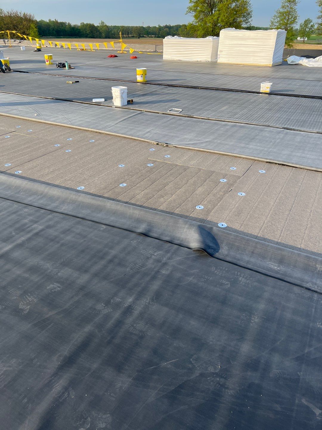 Commercial Roofing Installation using 60 mil rubber roof  by Nitro Roofing and Construction