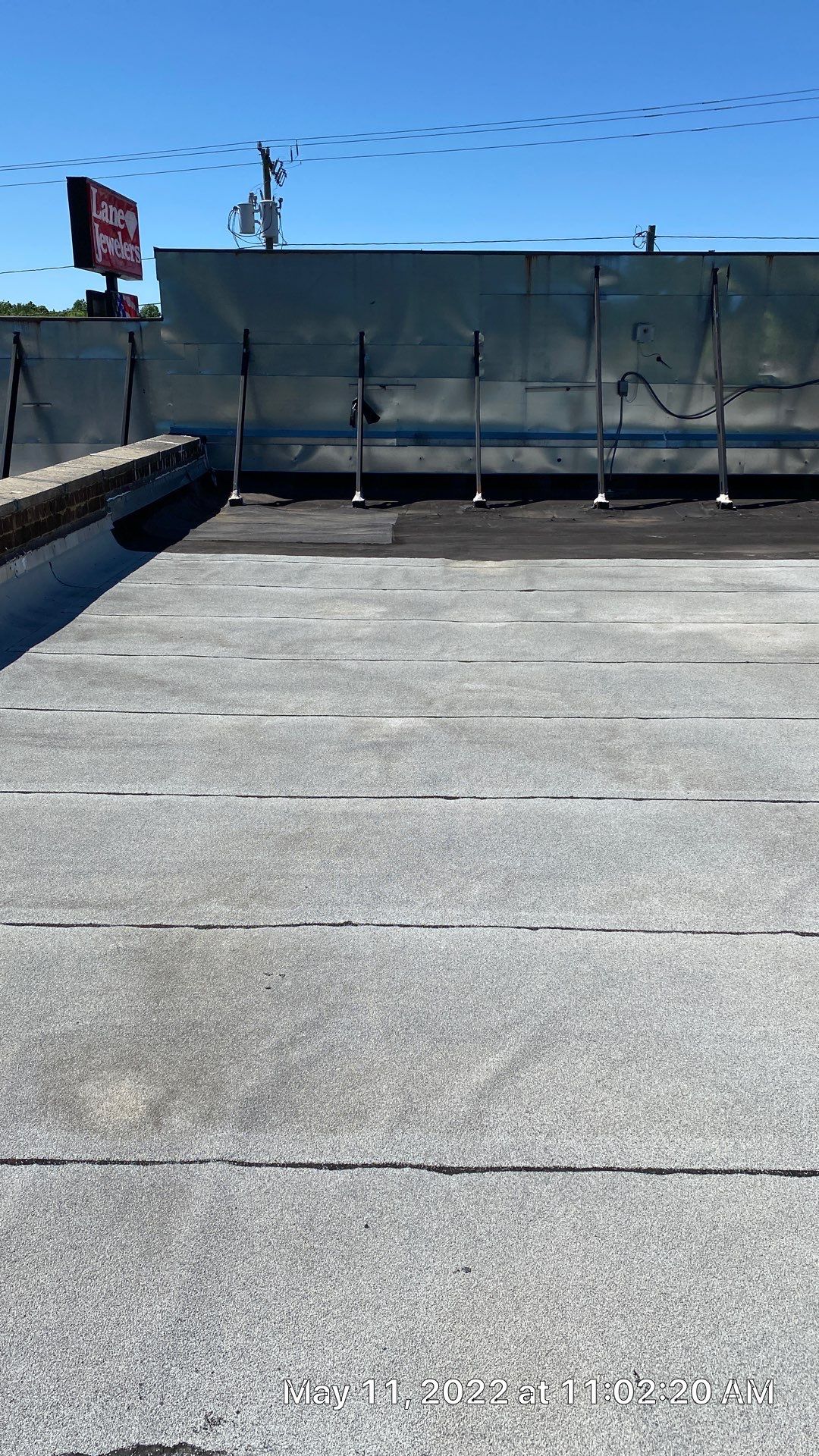 Commercial Roof Coating using Fiberseal basecoat and Silicon Topcoat by Just In Time Roofing and Restoration