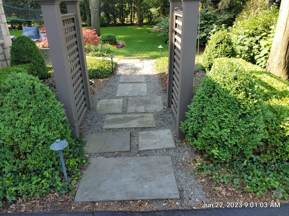 Northbrook, IL stucco home soft wash and stone cleaning by Northern Power Washing LLC.