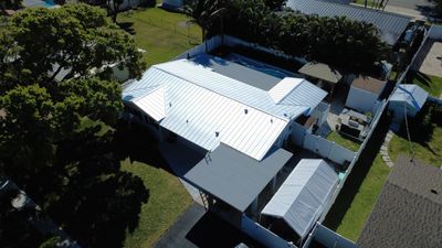 Residential Roofing Installation using 1" Nail strip metal roof