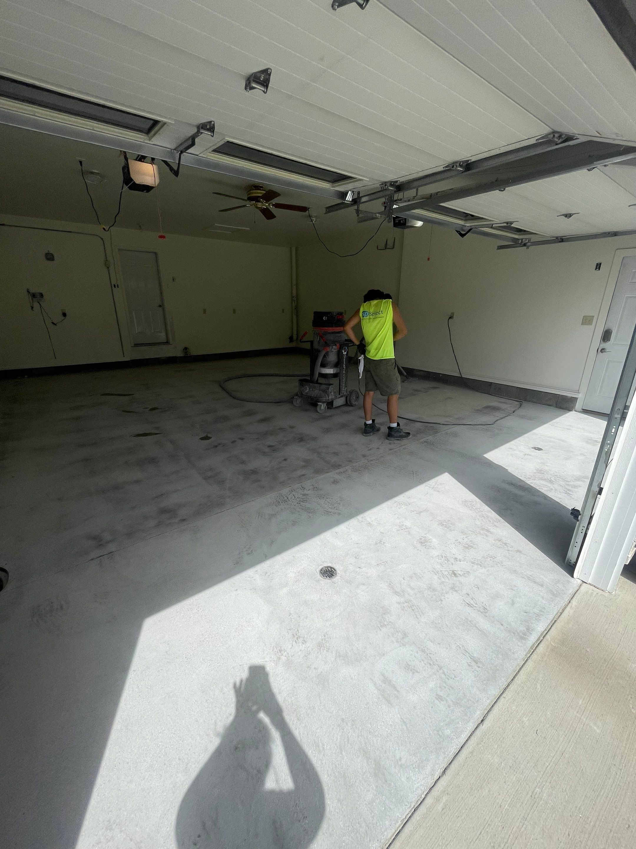 Madison Garage Concrete Coating with Feather Grey Speckle Finish by Select Painting, Coatings & Garage Cabinets