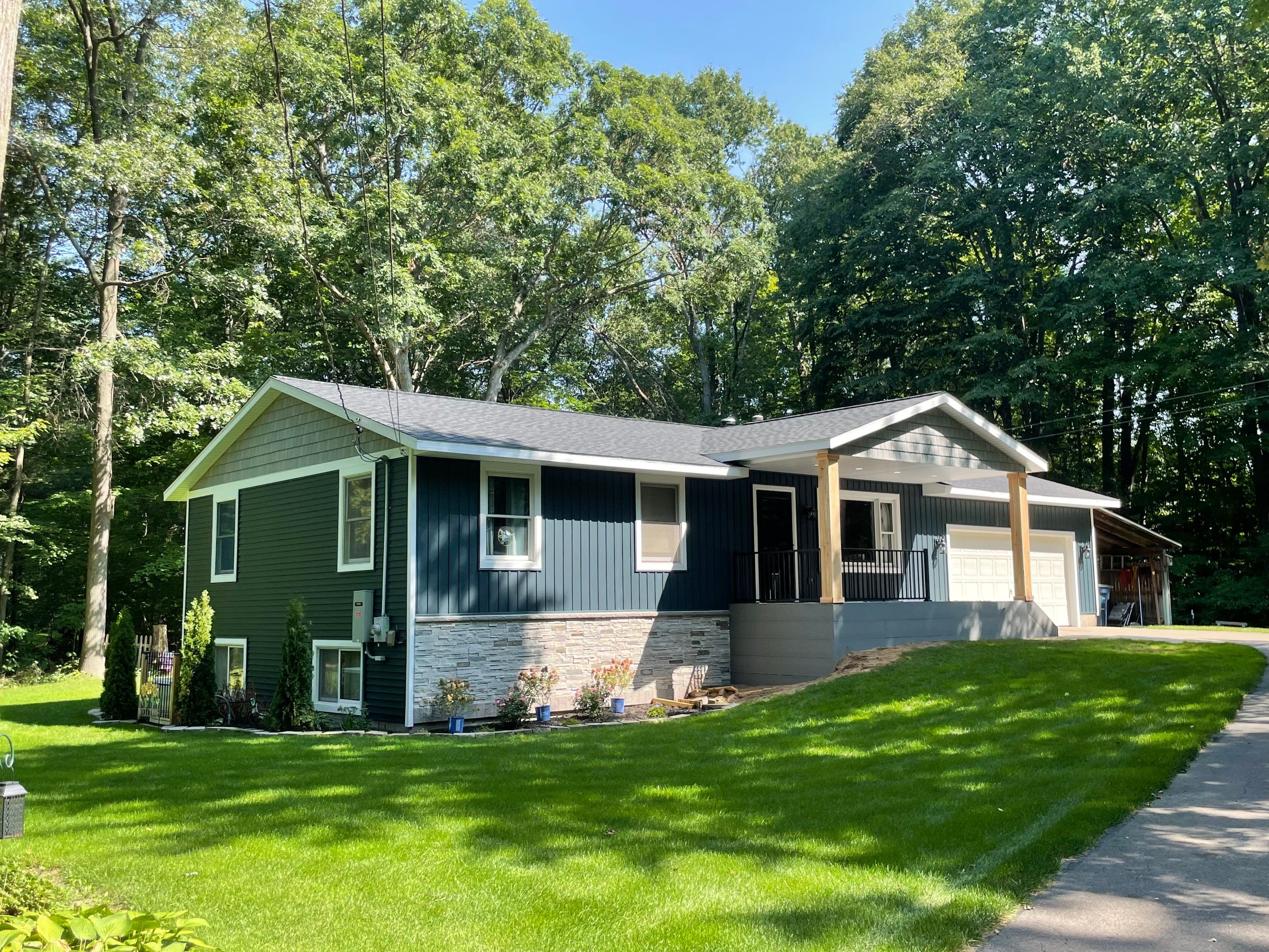 Siding, Deck and Versetta Stone by Avalon Roofing and Exteriors