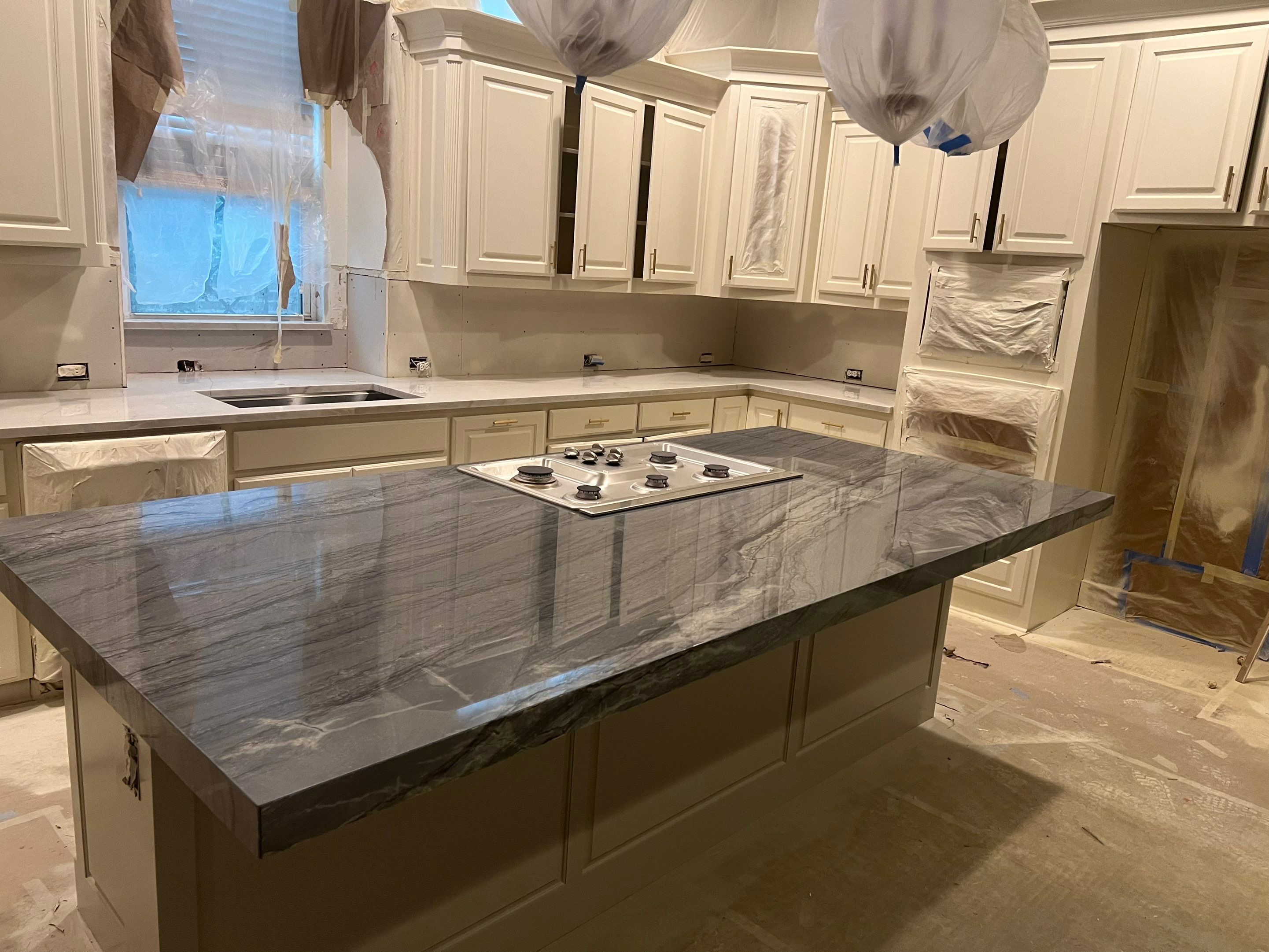 Kitchen Remodel using Quartzite by SLM General Contractors & Roofing
