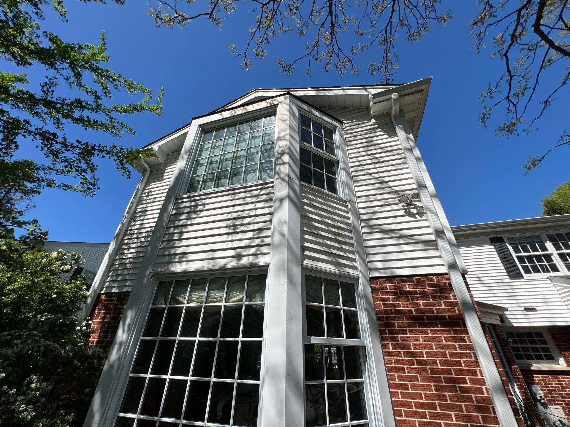 Housewashing  using Algaecide, soft wash soap by Northern Power Washing LLC.