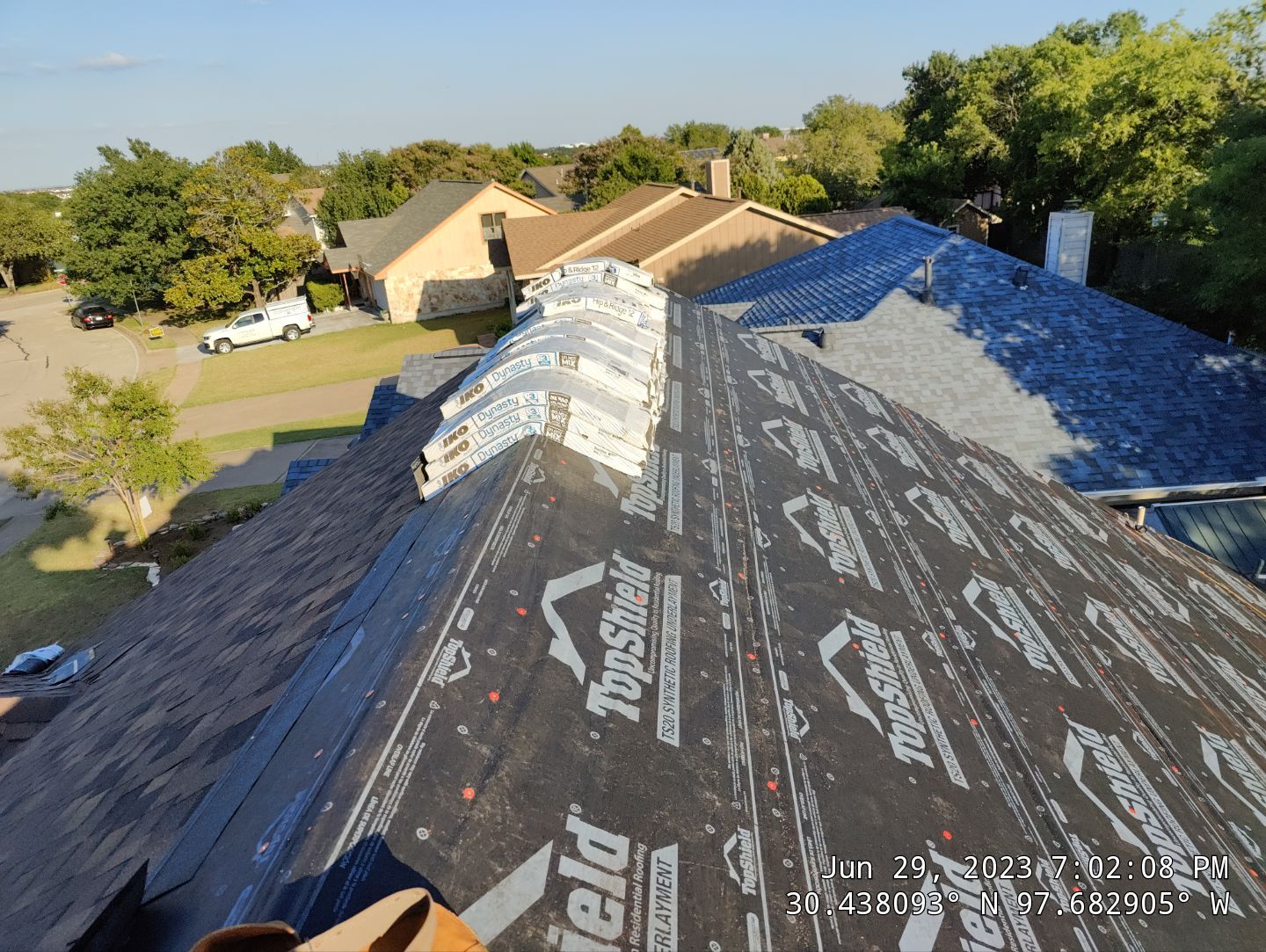New Roof Installation Of IKO Dynasty Color Brownstone by DeZign Roofing & Exteriors
