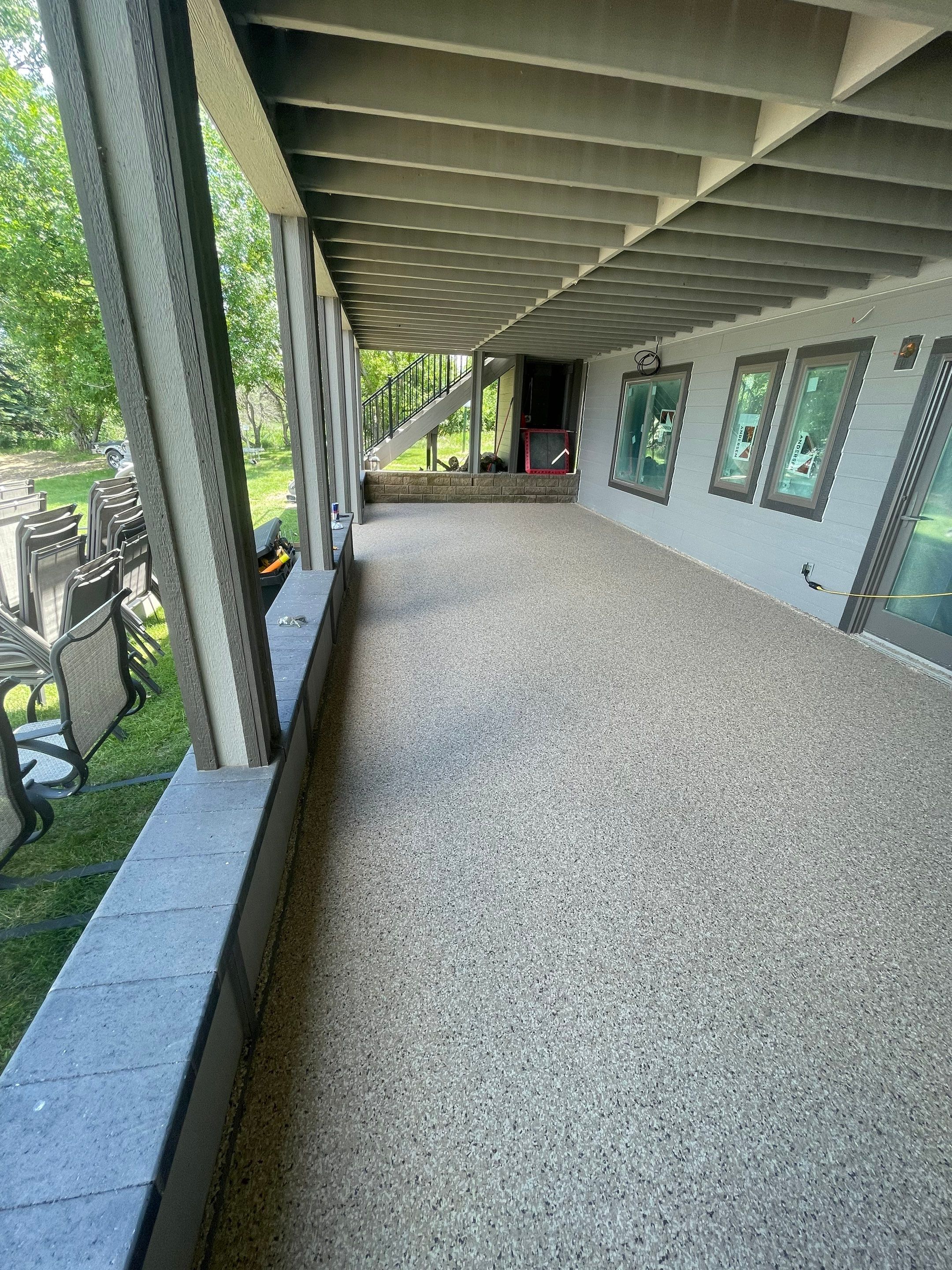 Lakefront Screened Patio Concrete Coating Installation in Wentworth by Select Painting, Coatings & Garage Cabinets