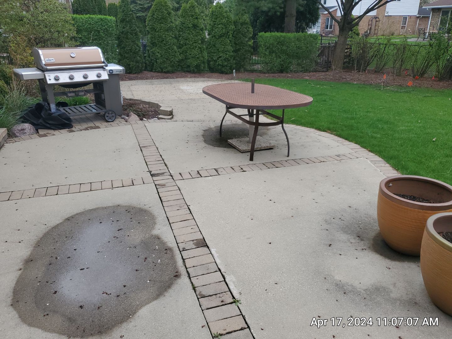 concrete patio and driveway cleaning by Northern Power Washing LLC.
