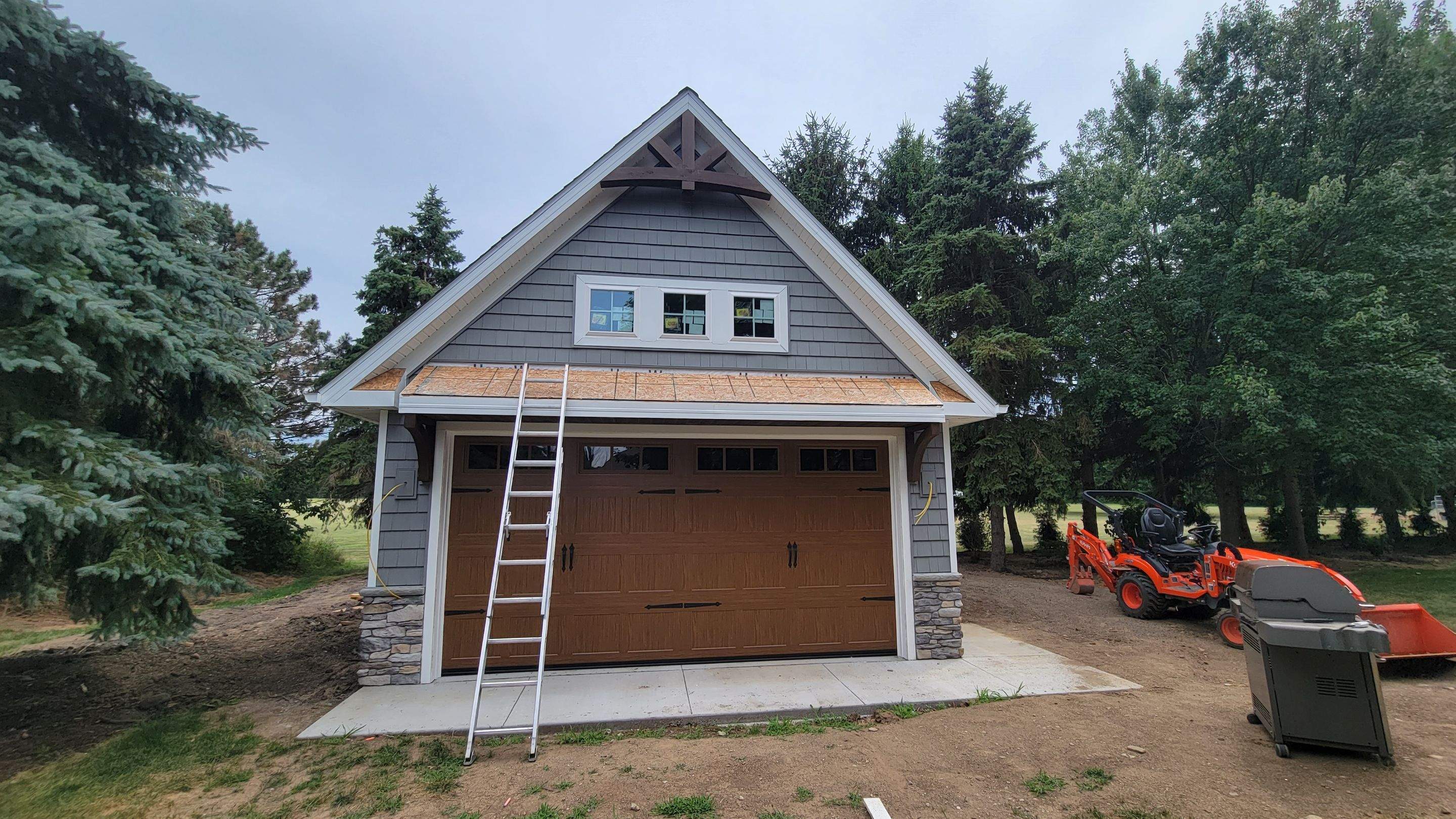 Garage Metal Roof using Standing Seam Metal by Absolute Roofing and Construction