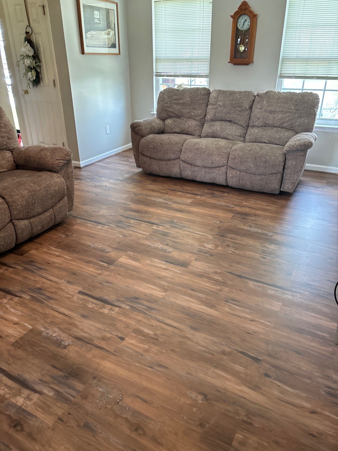 Living room LVP Flooring install  by Laser Focused Solutions LLC