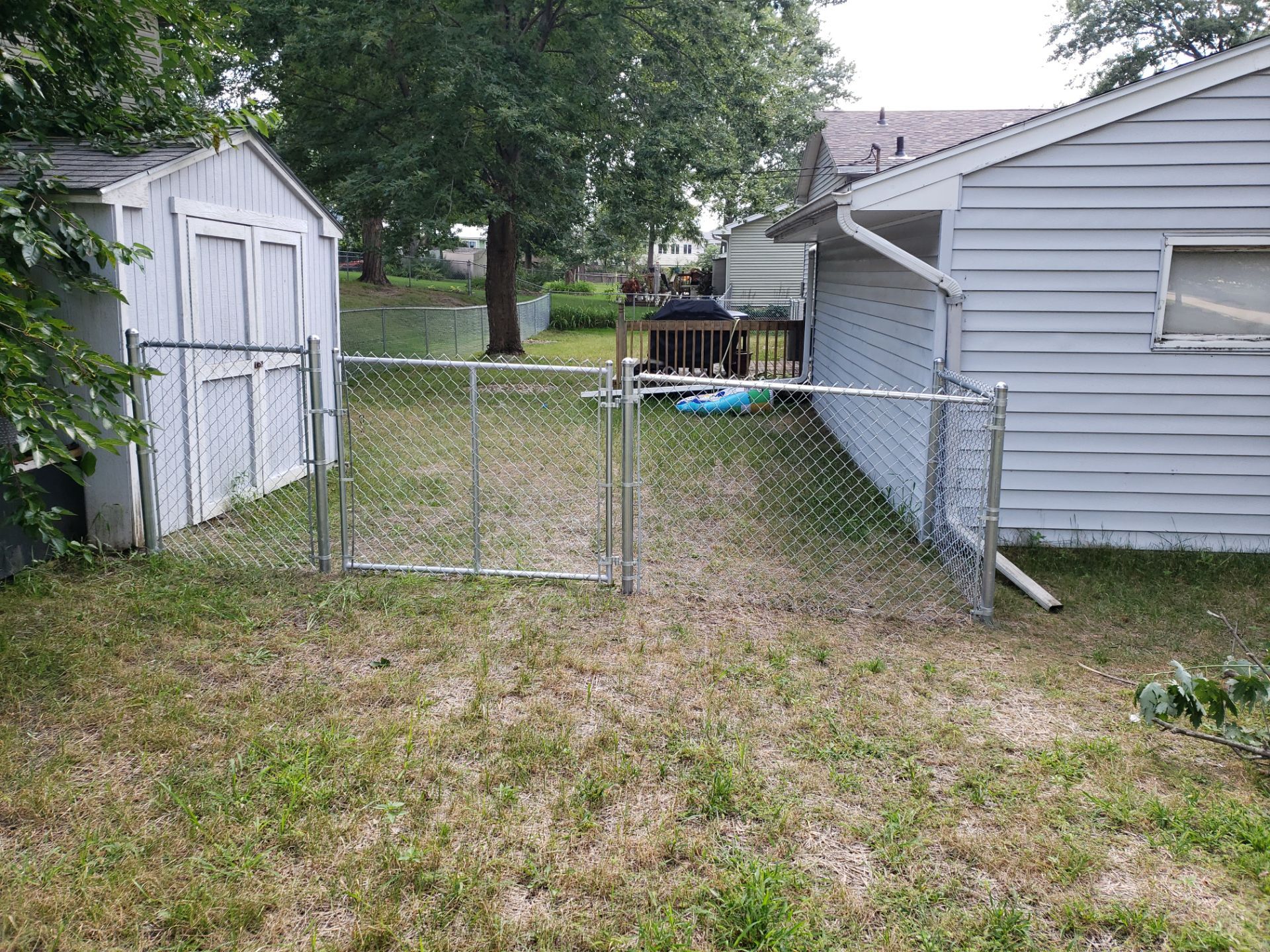 Galvanized Chain Link Backyard Fence and Gate Installation in Cedar Falls by Perfect Picket Fence and Stain