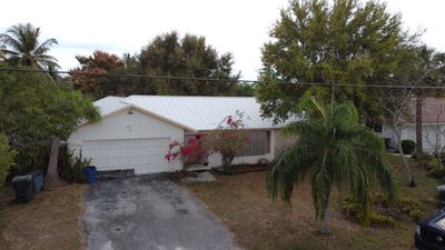 Residential Roofing Installation using 1" Nail strip metal roof