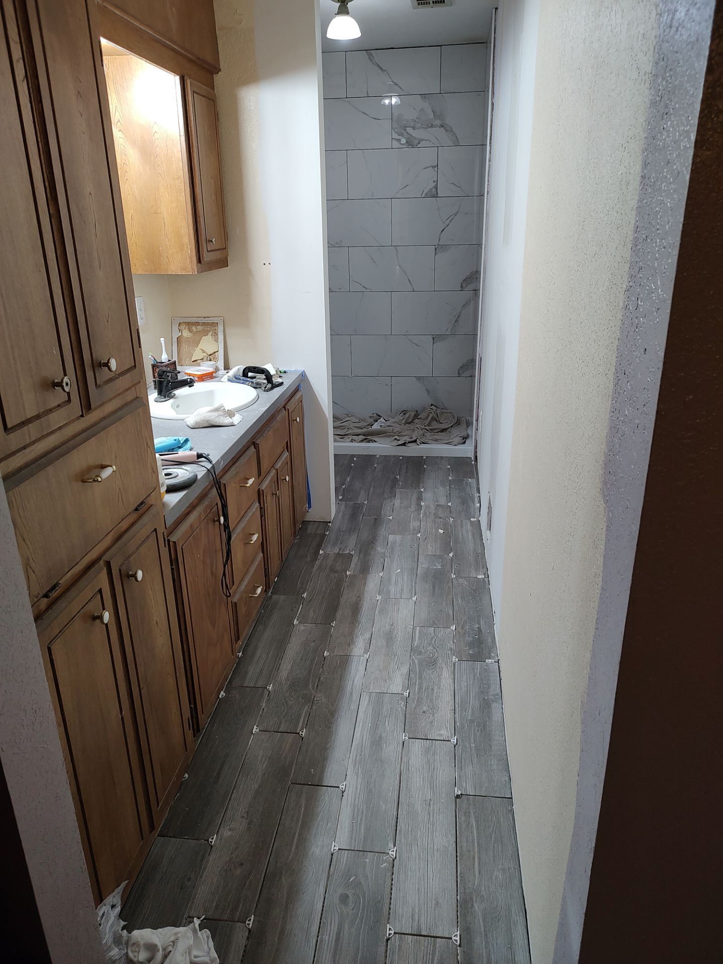 Bathroom remodel w/shower upgrade by In & Out Construction & Remodeling, LLC