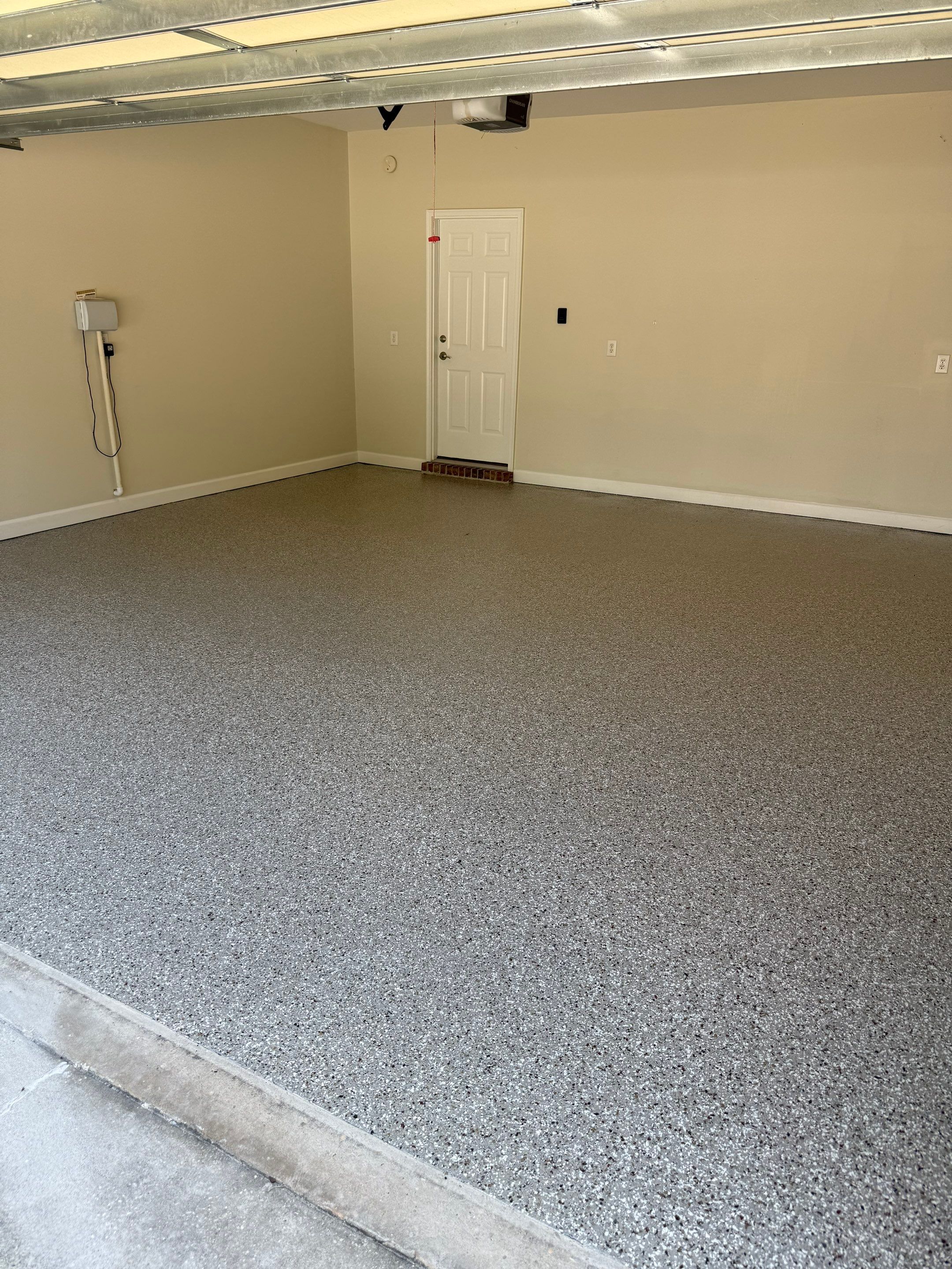 Epoxy Flake Garage Floor Coating for Fairhope Residence by Cornerstone Hard Surface Restoration