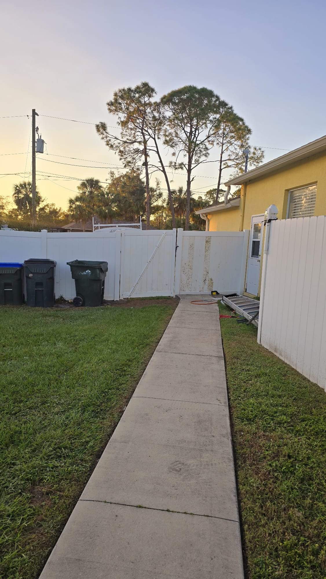 White Vinyl Privacy Fence Repair and Gate Installation in North Port by True Fence LLC