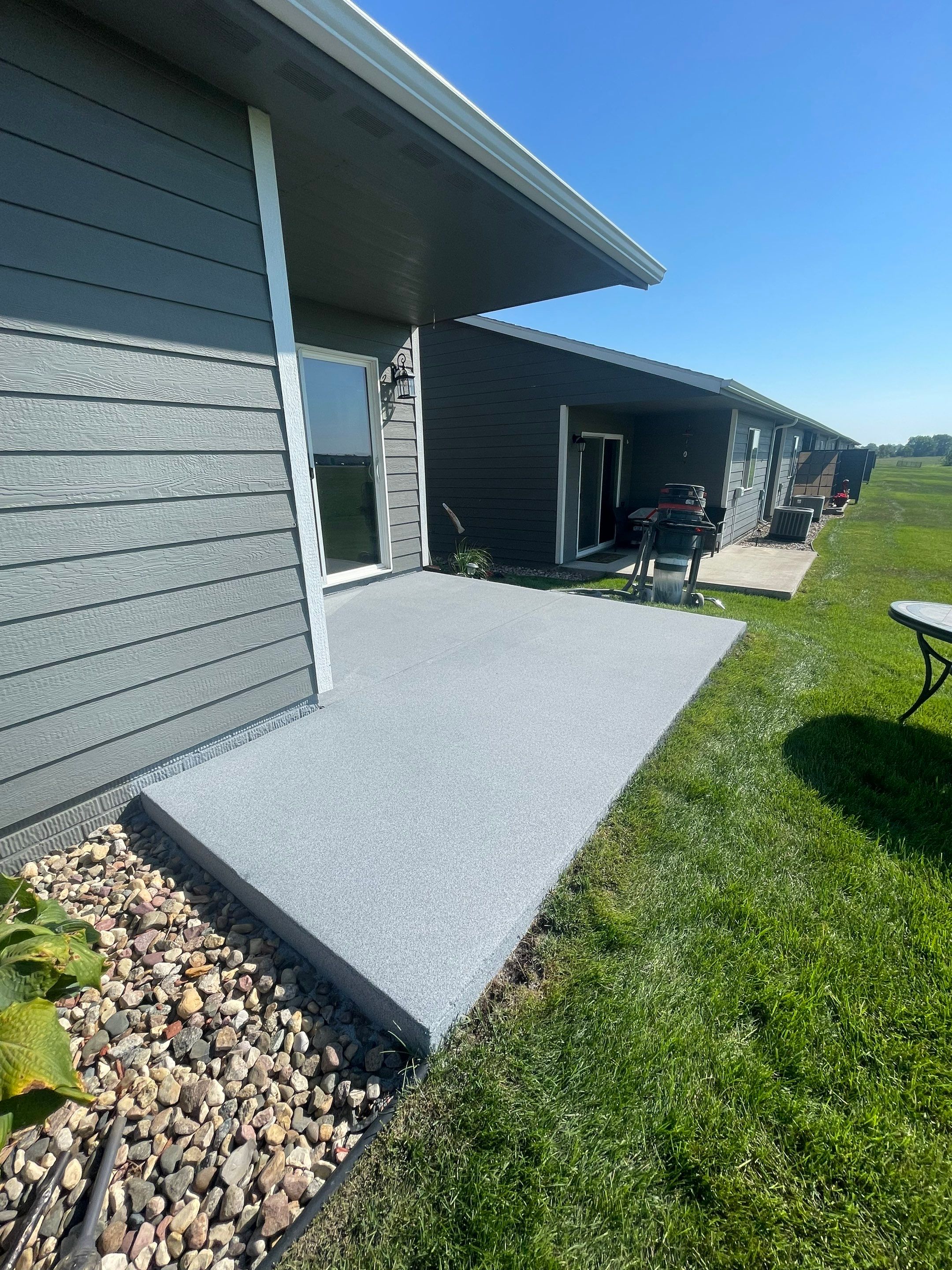 Starry Evening Concrete Patio Coating Installation in Tea by Select Painting, Coatings & Garage Cabinets