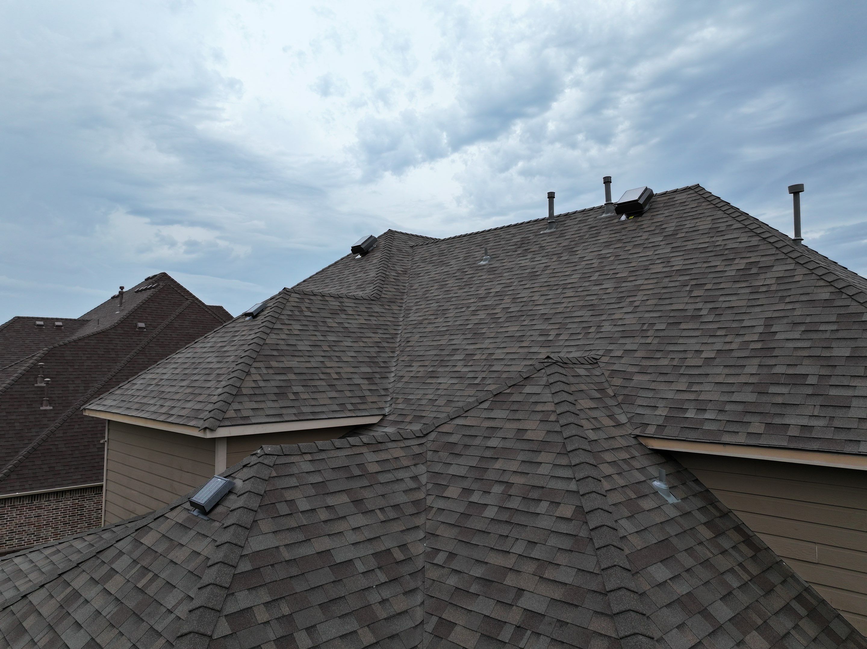 Installing Custom copper turret and Malarkey Vista Class 4 shingles Hail Damage Upgrade by Becker Roofing and Exteriors