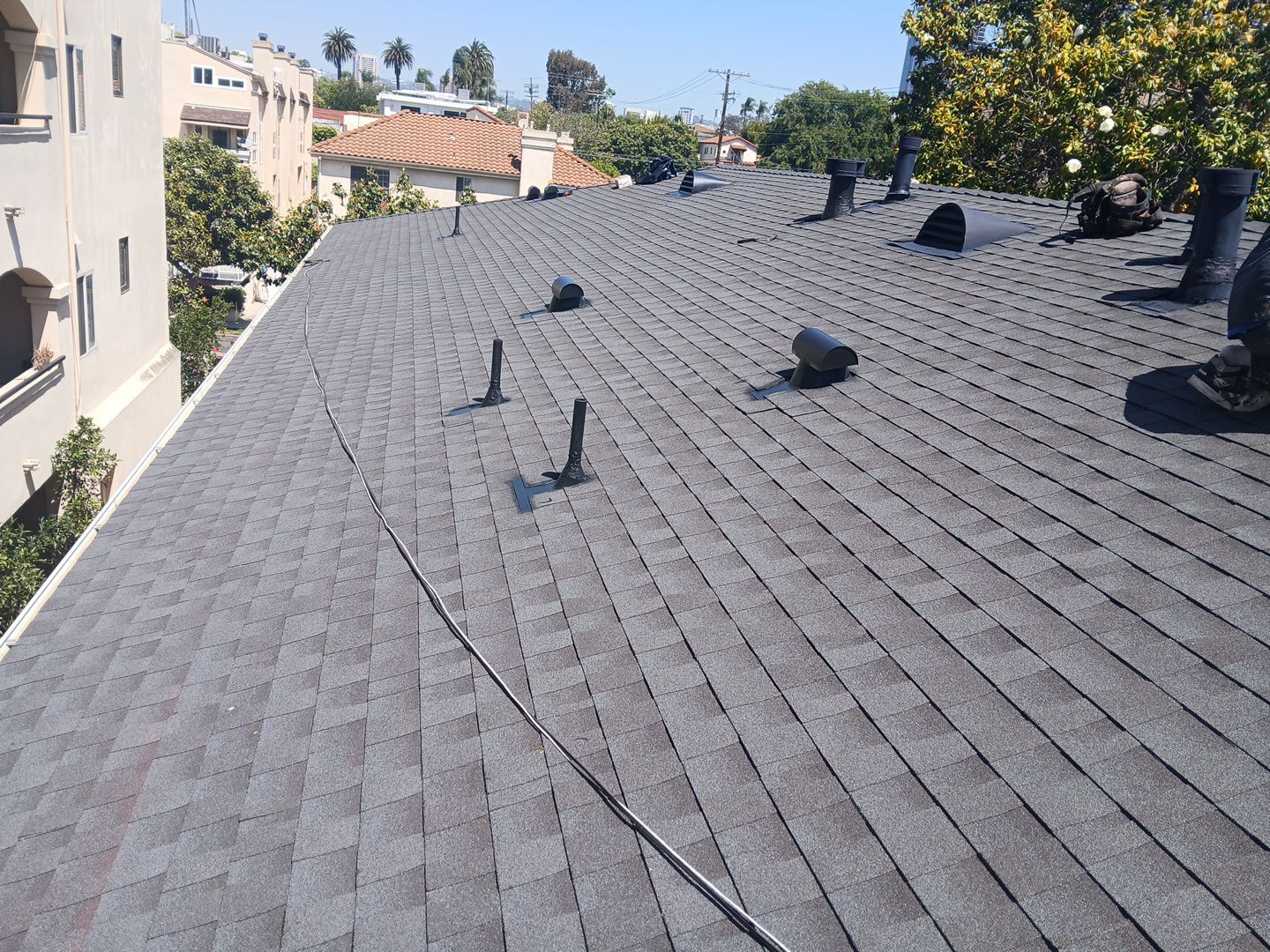 Apartment Building 2nd Layer Installation &Silicone coating by Hull Brothers Roofing