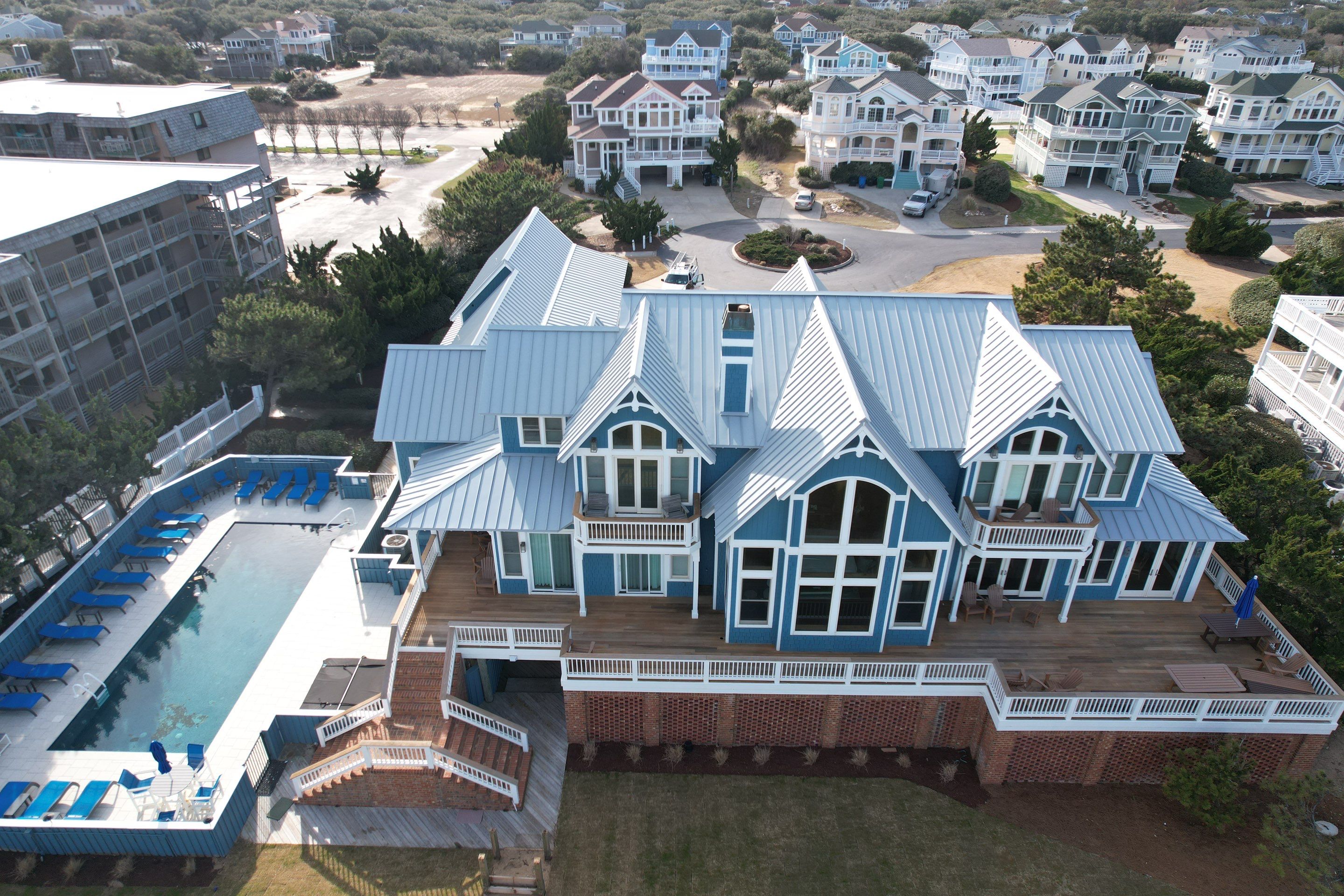 Large Metal Roof Transformation by Gallop Roofing & Remodeling, Inc.