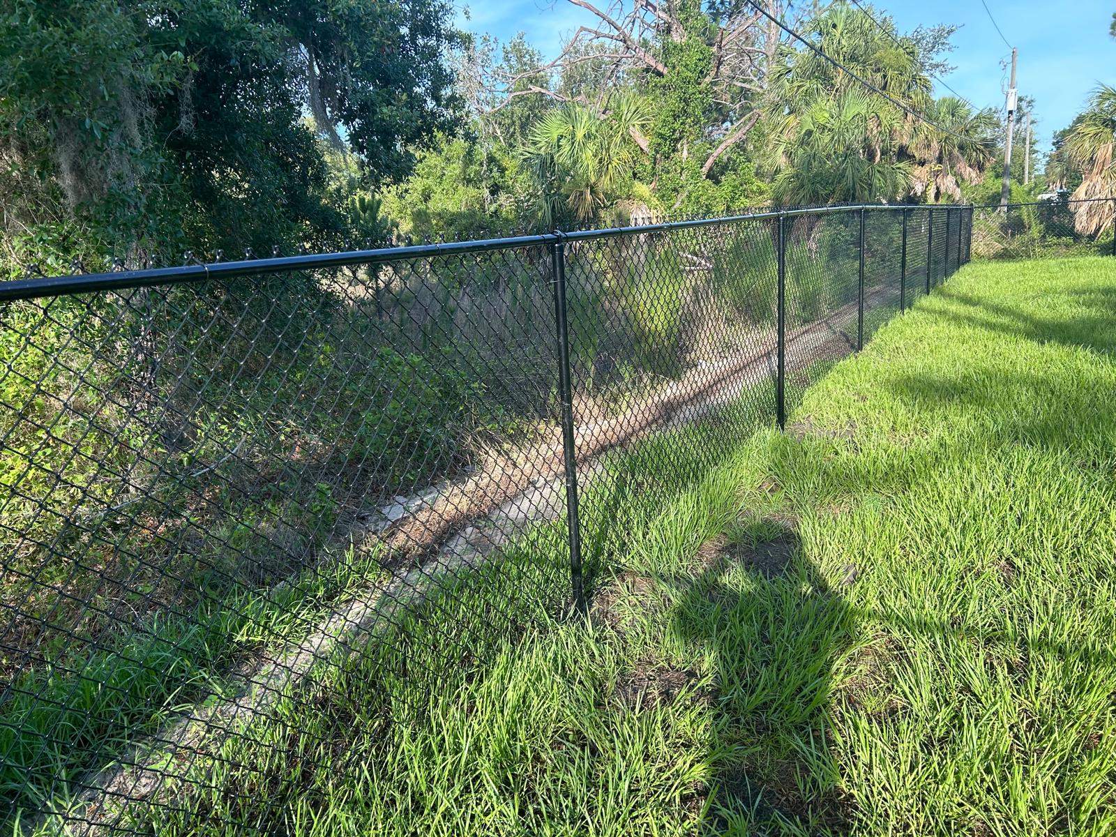 Residential Black Vinyl-Coated Chain Link Fence in Port Charlotte by True Fence LLC