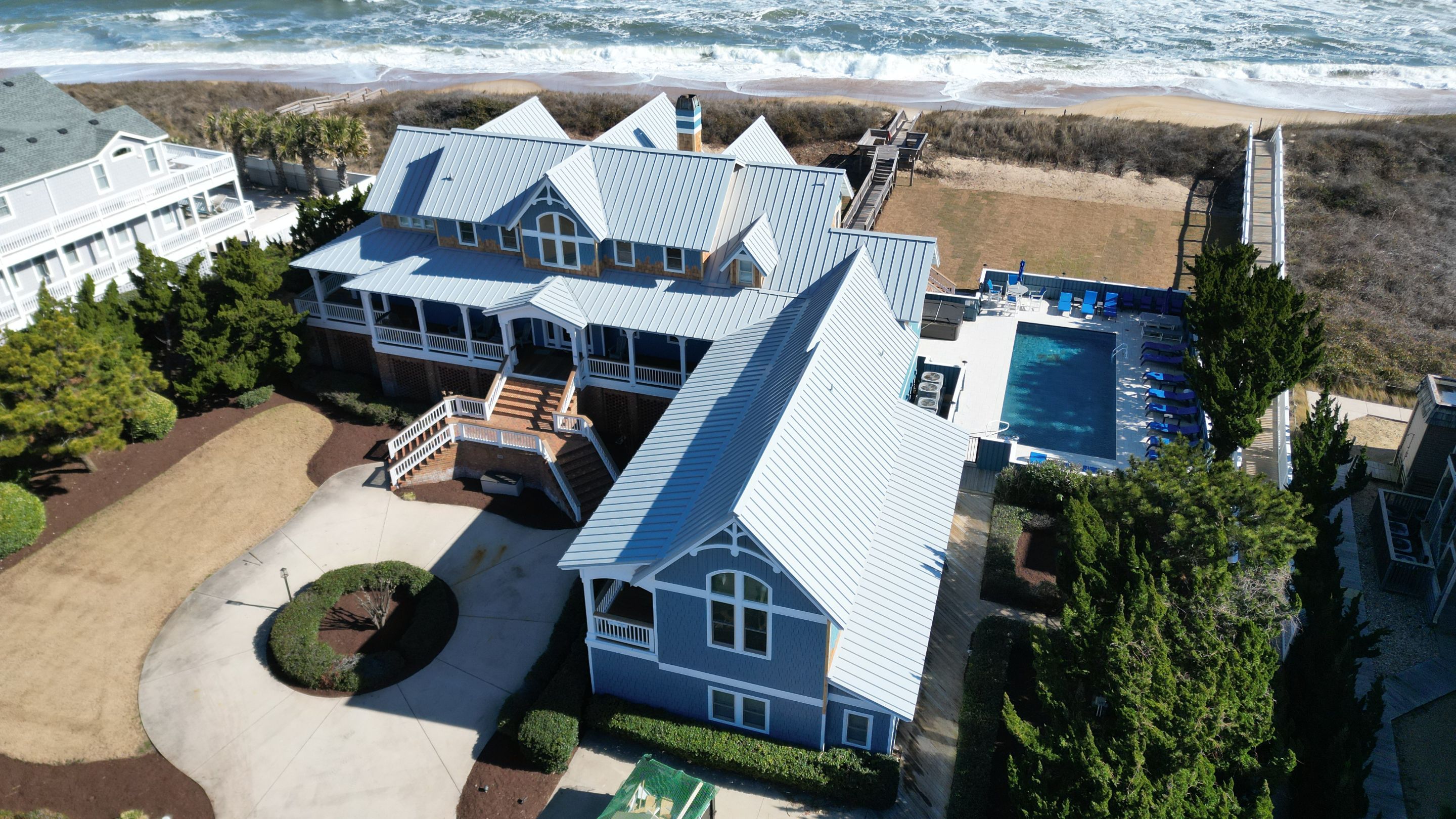 Large Metal Roof Transformation by Gallop Roofing & Remodeling, Inc.